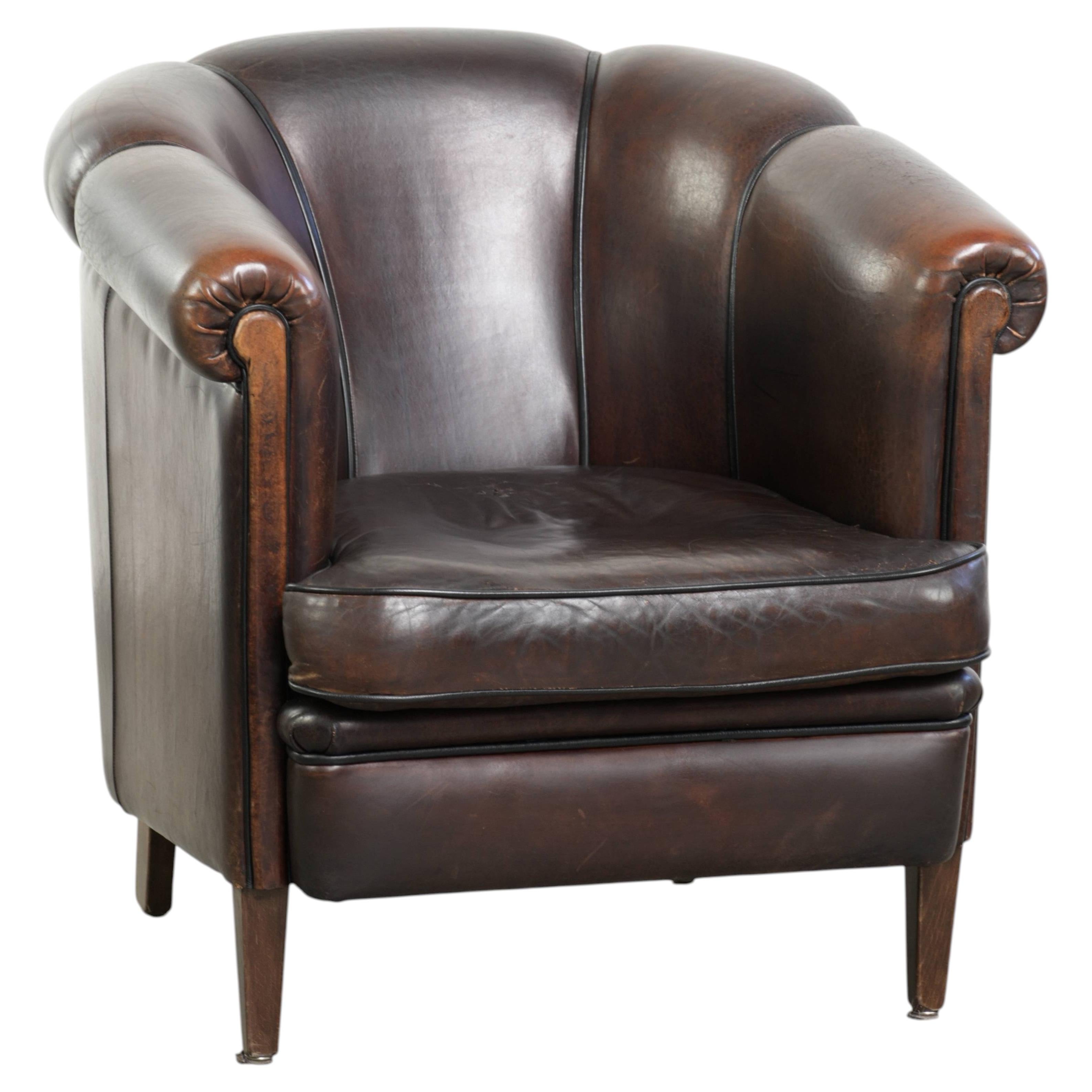 Dark sheepskin club armchair with unique design in English style