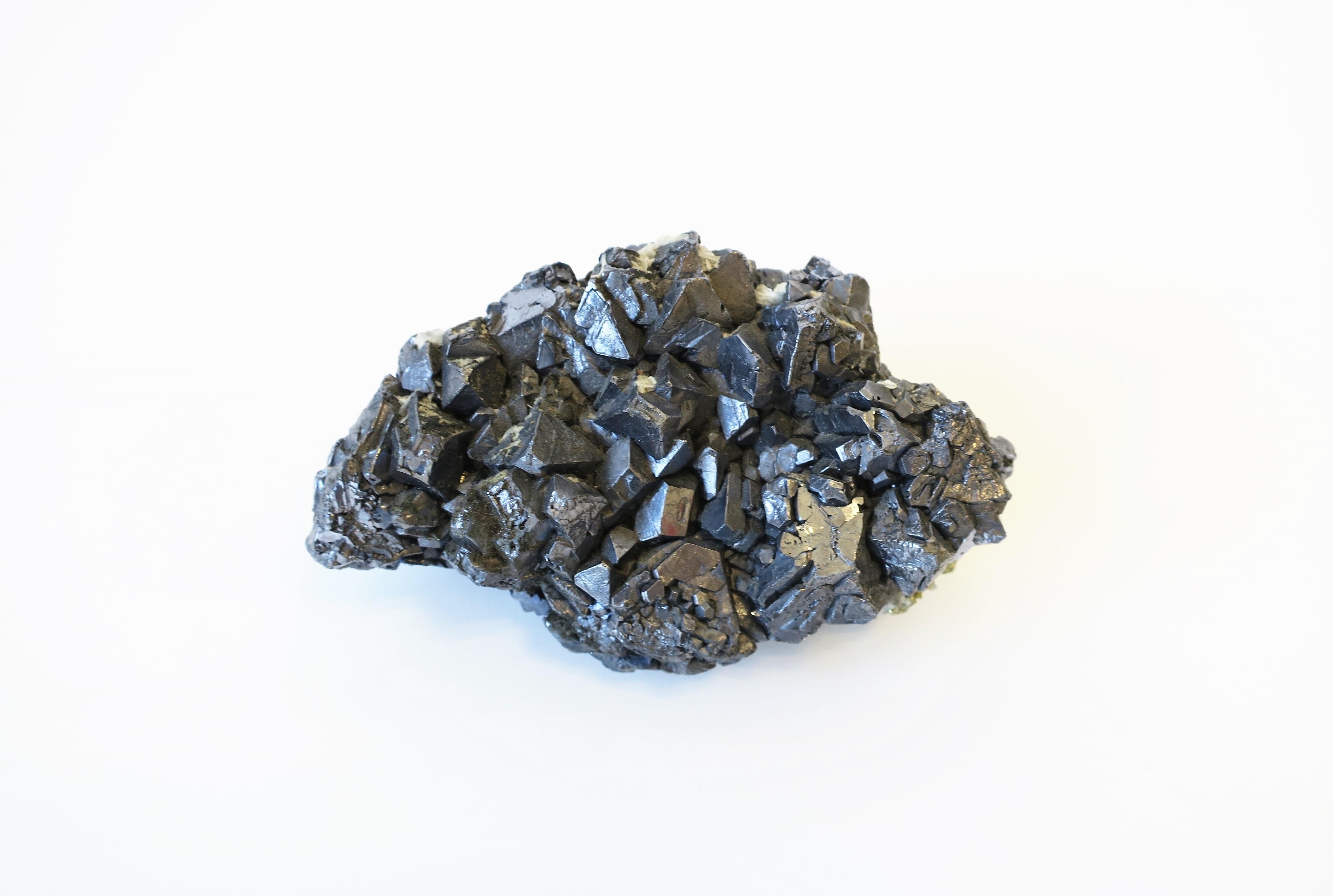 A beautiful and substantial dark silver Galena natural crystal mineral stone decorative object. This natural crystal mineral makes a great standalone decorative object, paperweight on a desk, or luxury display piece, etc. 

Piece measures: 5