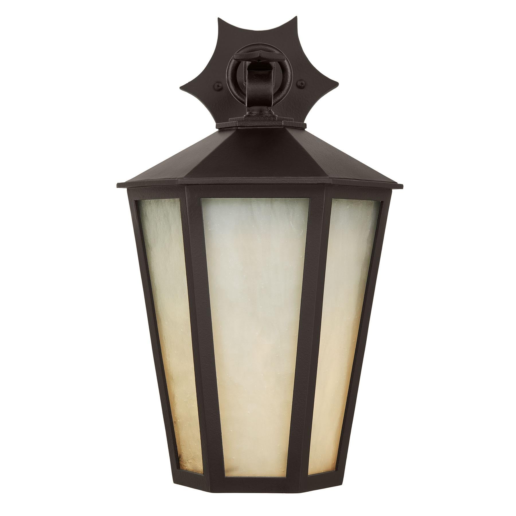 This Heirloom Quality Lantern designed by Architect Anthony Grumbine features a classic tapered form, dramatic curved arm and star detailing, this large hexagonal fixture is striking in numerous exterior, as well as interior, settings and