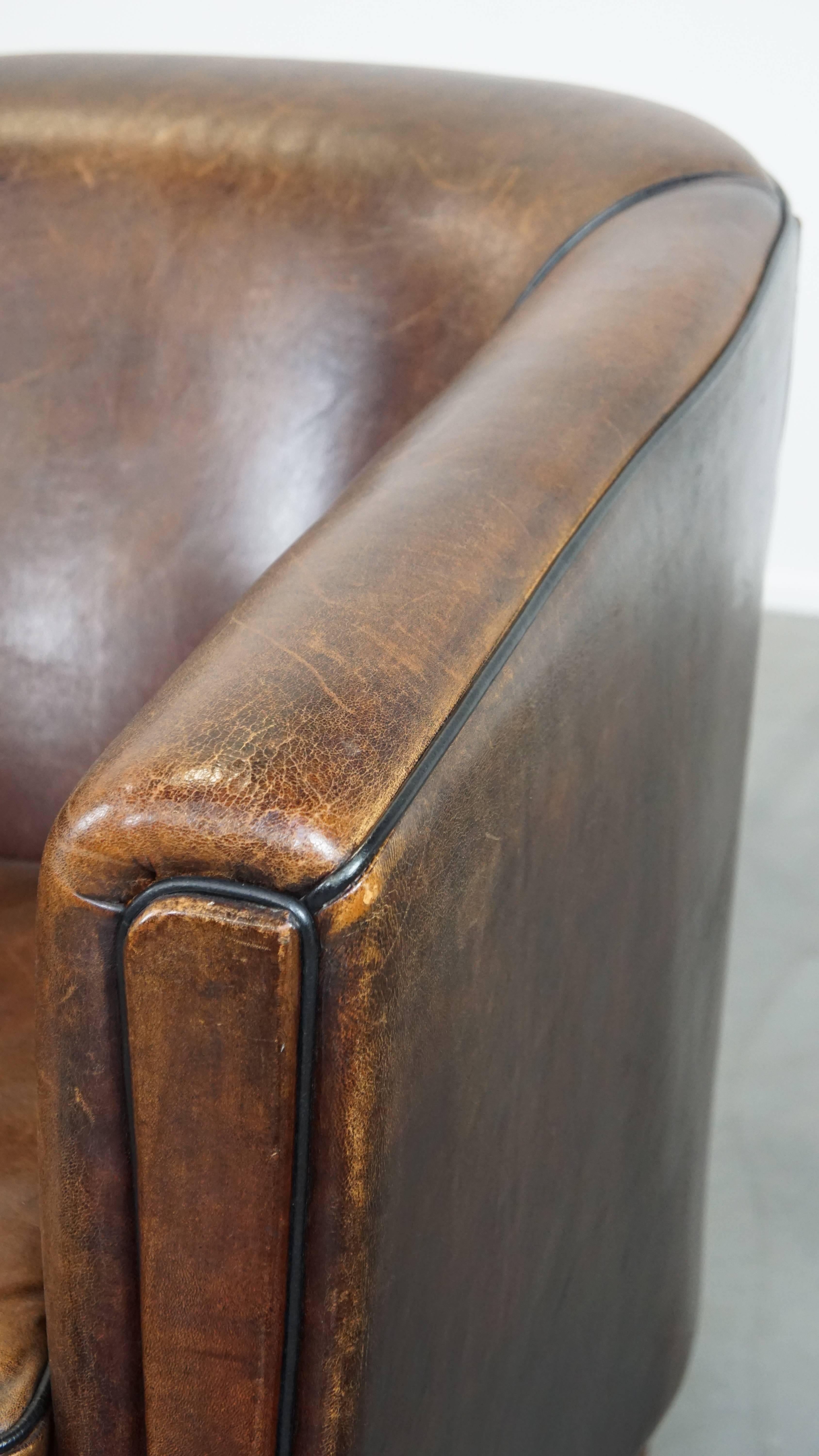 Dark, sleek, luxurious sheepskin leather club armchair with beautiful colors For Sale 4