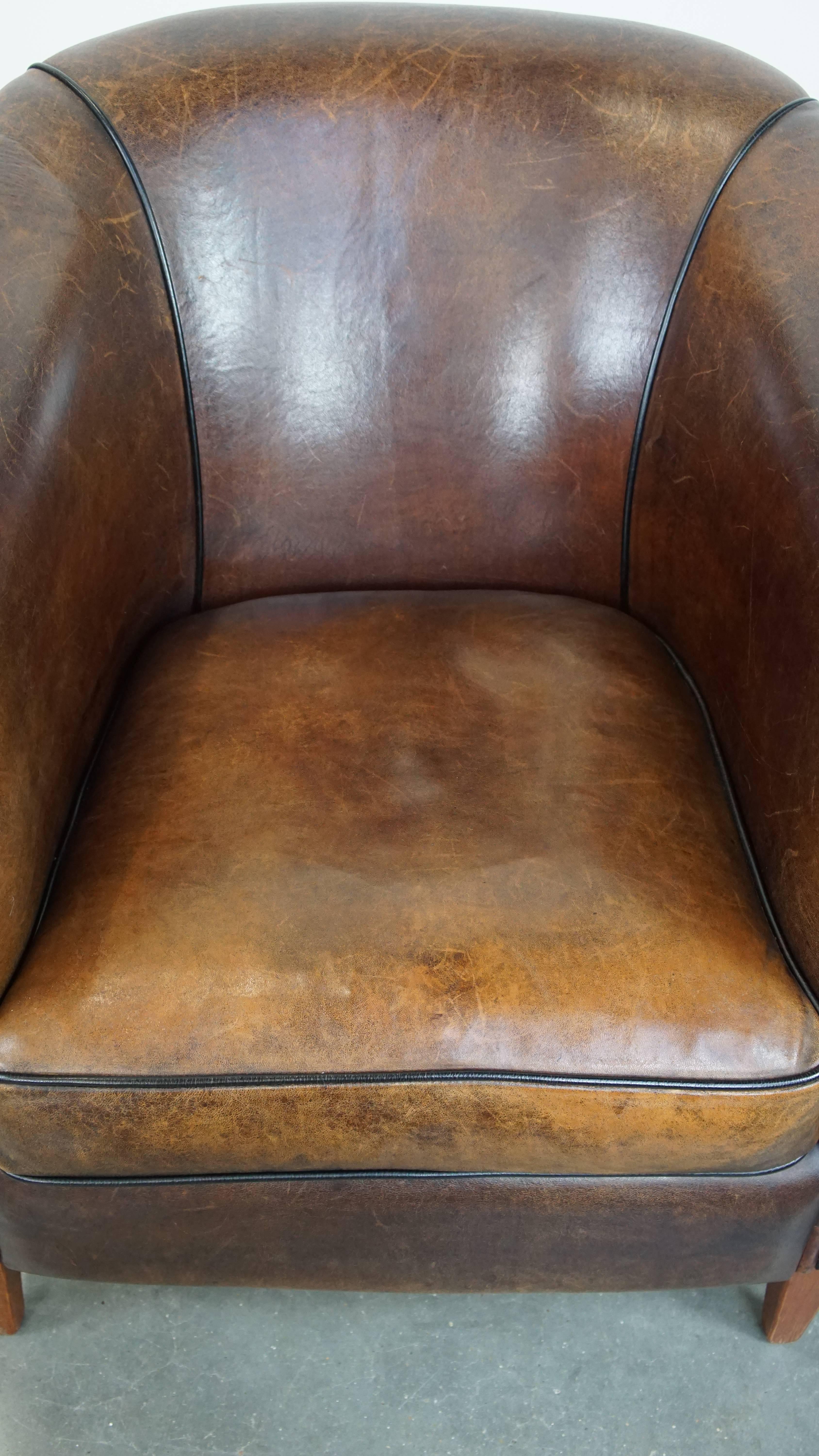 Sheepskin Dark, sleek, luxurious sheepskin leather club armchair with beautiful colors For Sale