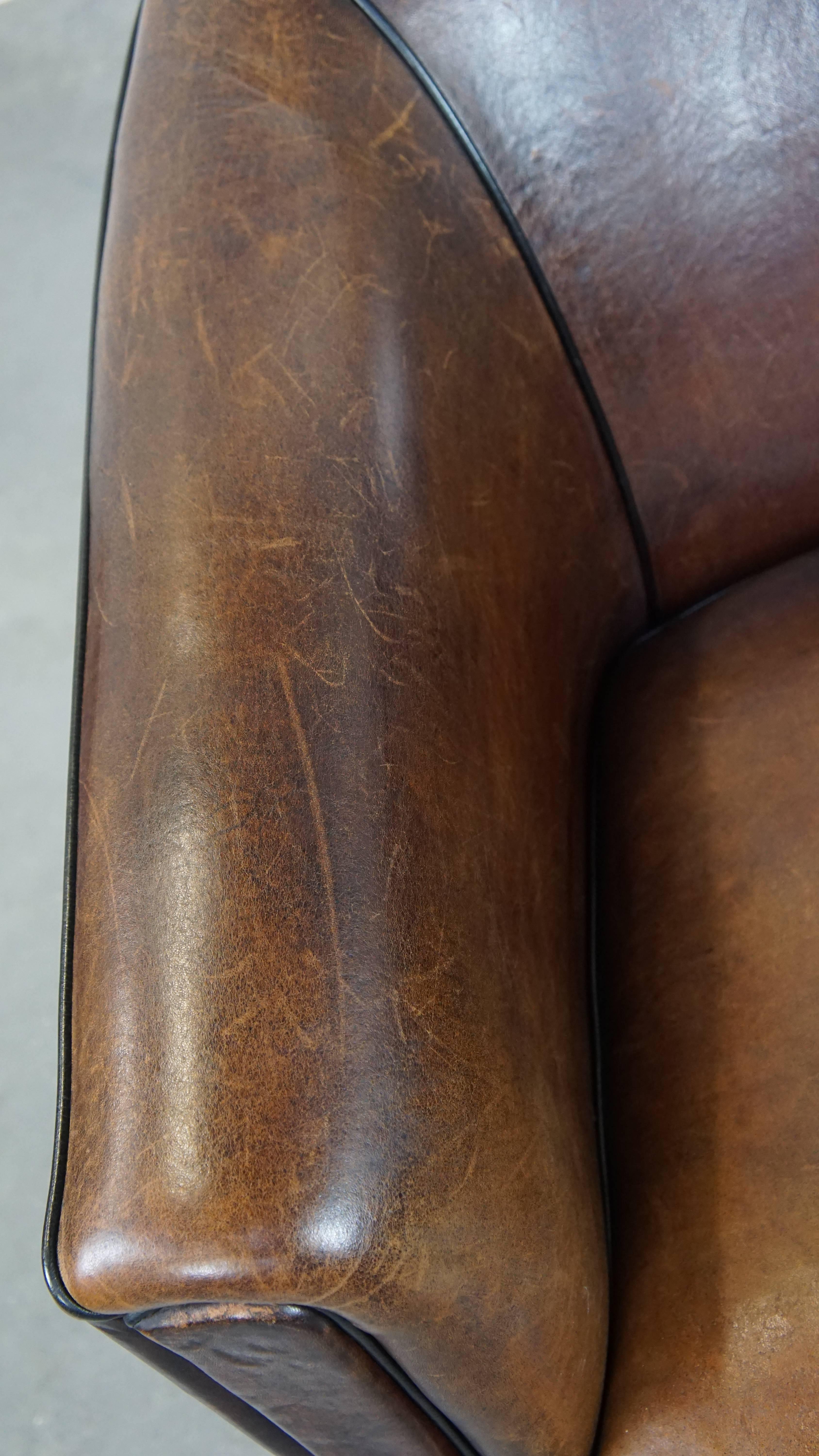 Dark, sleek, luxurious sheepskin leather club armchair with beautiful colors For Sale 1