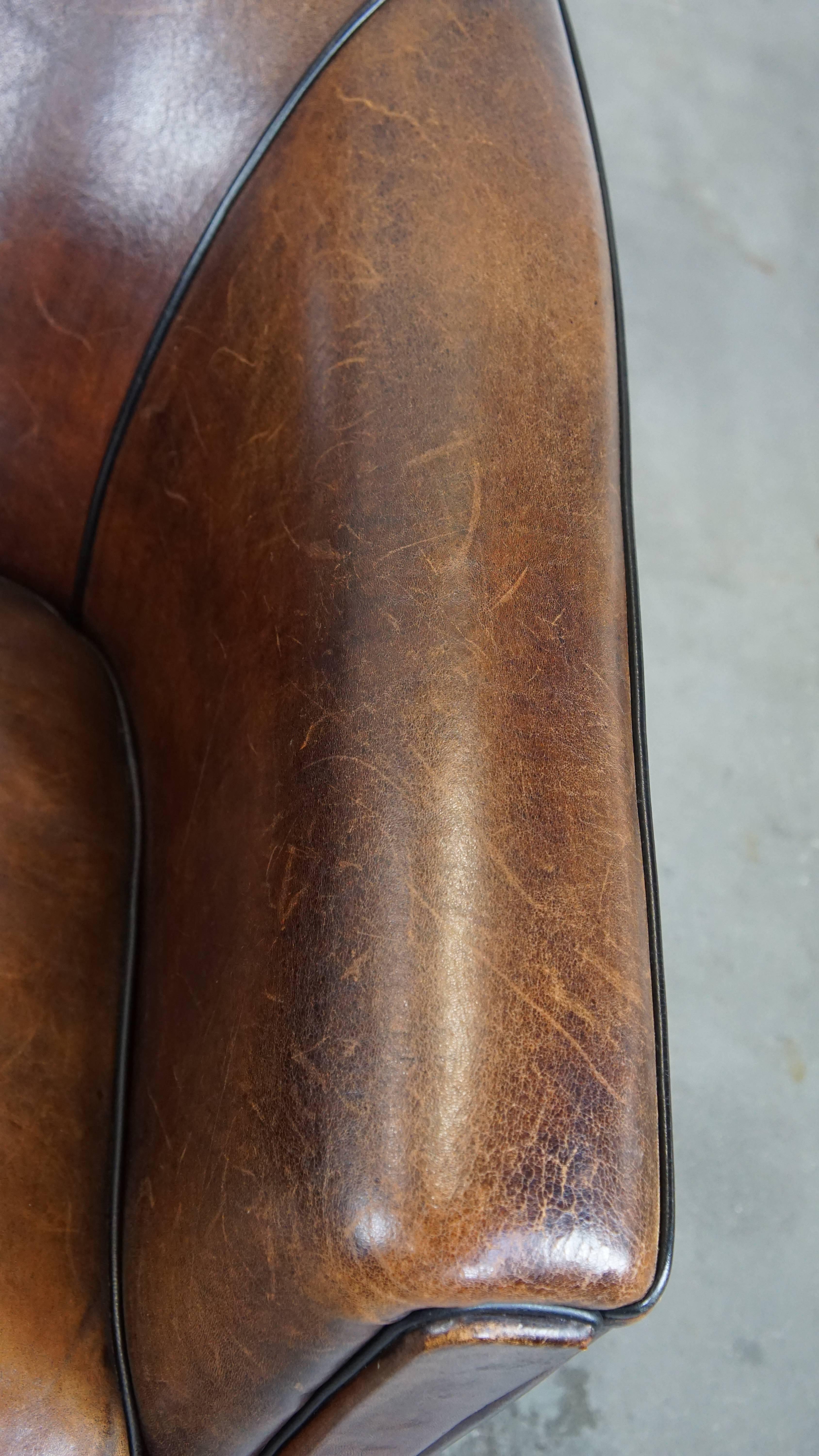 Dark, sleek, luxurious sheepskin leather club armchair with beautiful colors For Sale 2