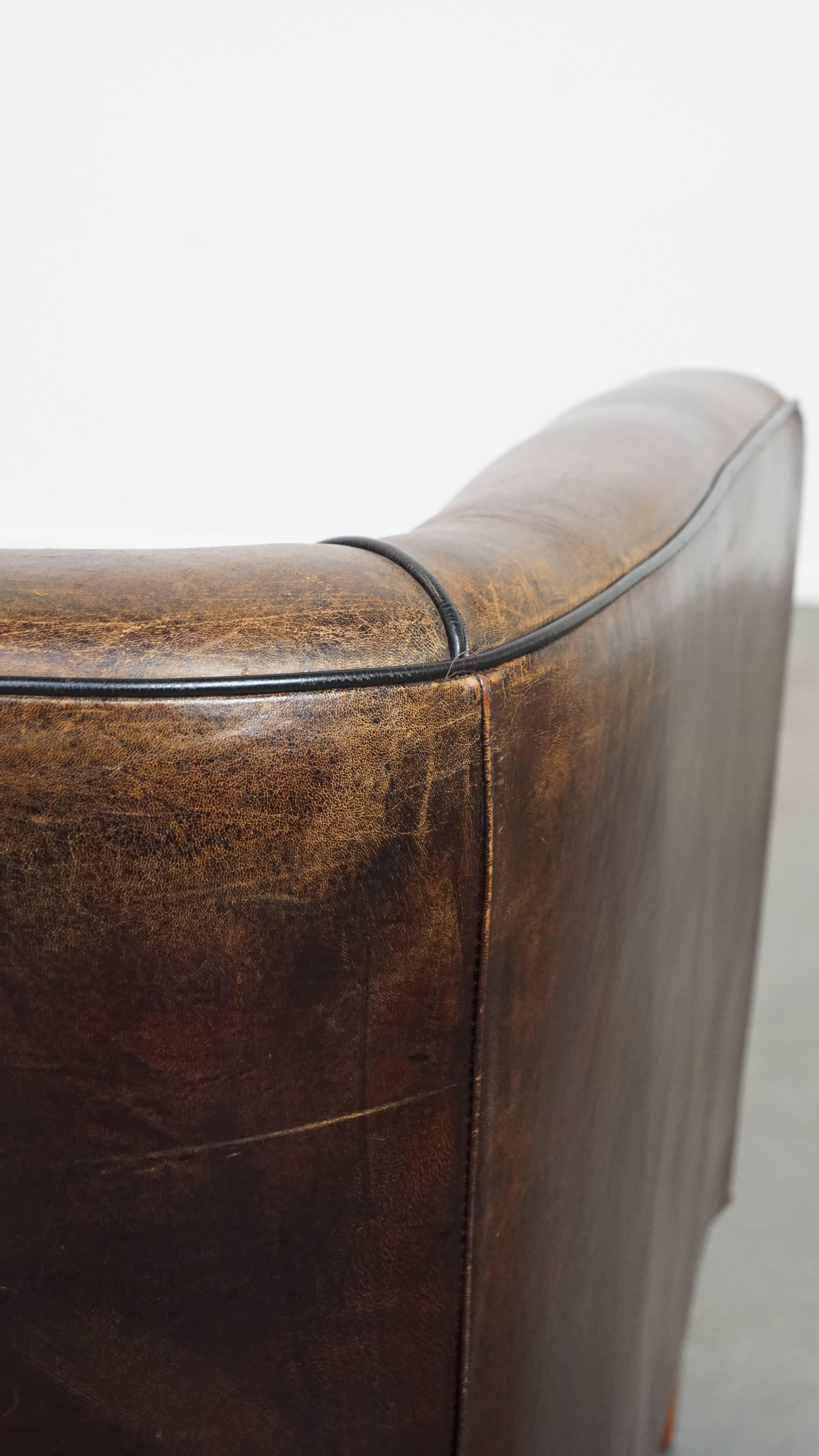 Dark, sleek, luxurious sheepskin leather club armchair with beautiful colors For Sale 3