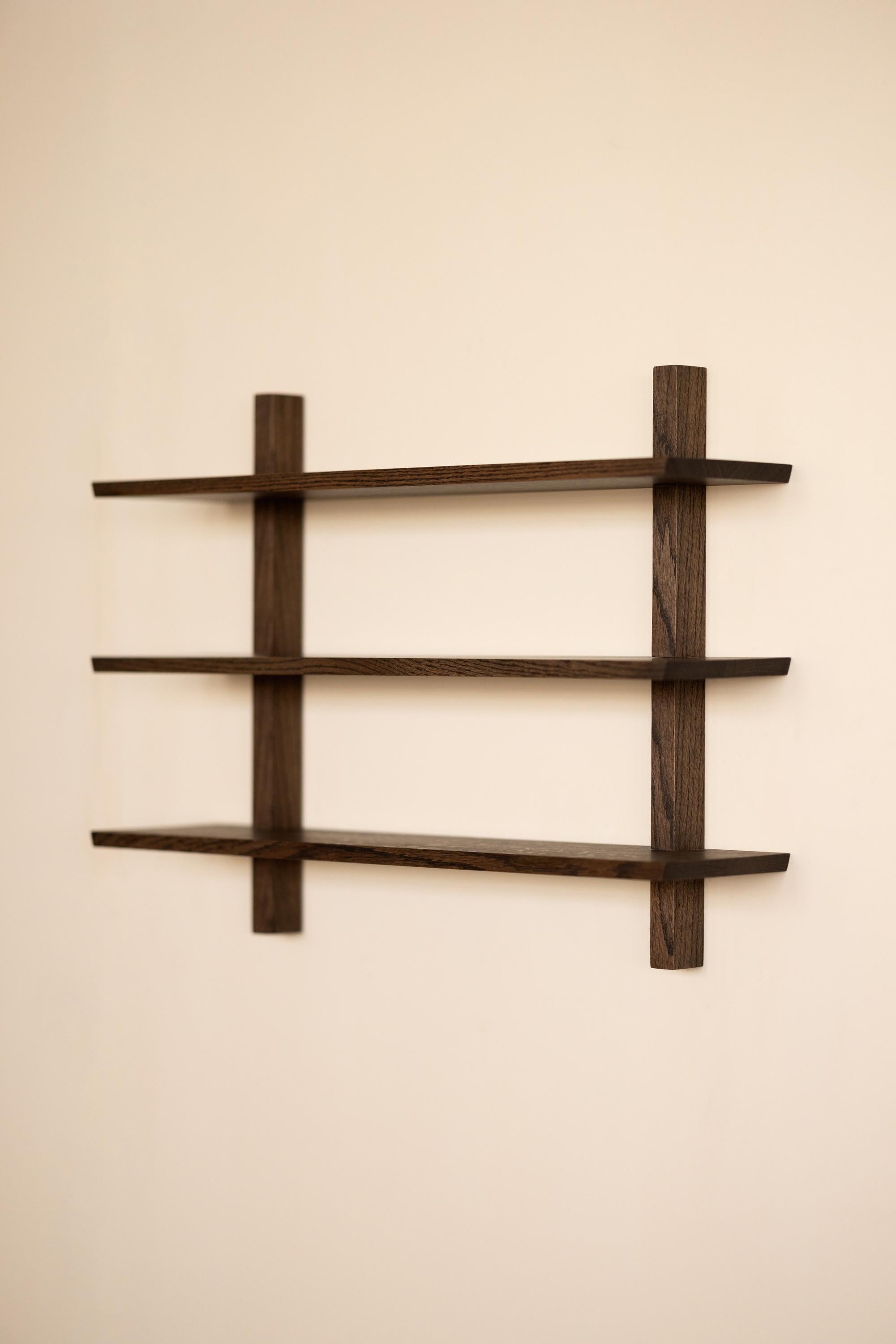 This Floating Shelving Unit offers a new and modern take on Mid-century wall storage. Defined by sturdiness and minimalism, this Still Life floating shelving unit is available in natural walnut or stained oak. 

What is now called a 