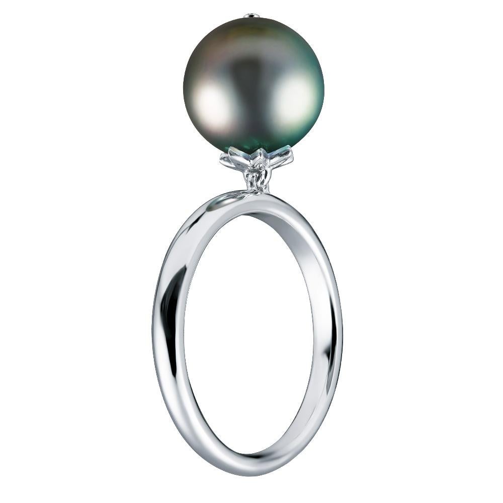 - 1 Round Diamond- 0.02 ct, E-F/VS
- 12.1 mm Dark Tahitian pearl
- 14K White Gold 
- Weight: 4.69 g
- Size: 16 mm
This delicate 14K white gold ring that holds a dangling dark Tahitian pearl 12.10 mm that sways gently when you move. 
The Pearl Dreams