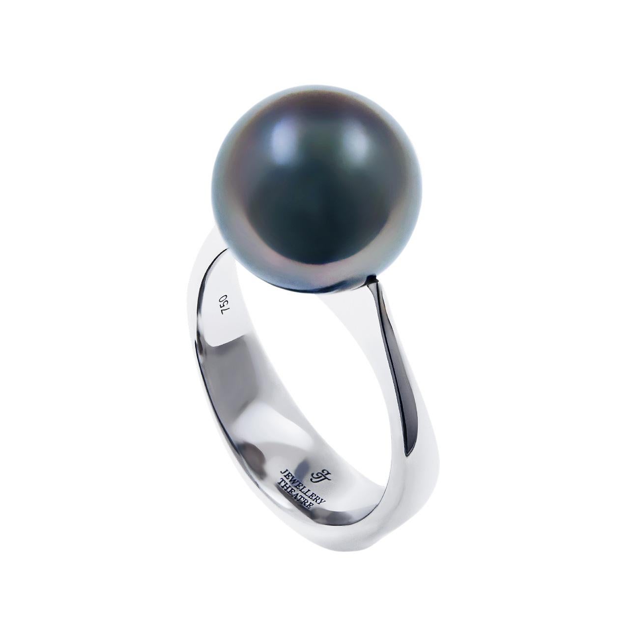 -28 Round Diamonds - 0.10 ct, G/VVS1-VVS2
- 10.5 mm Dark Tahitian pearl
- 18K White Gold 
- Weight: 5.44 g
- Size: 15.5 mm
This elegant ring by Jewellery Theatre features a lustrous dark Tahitian Pearl. Ring has a heel at the bottom decorated with