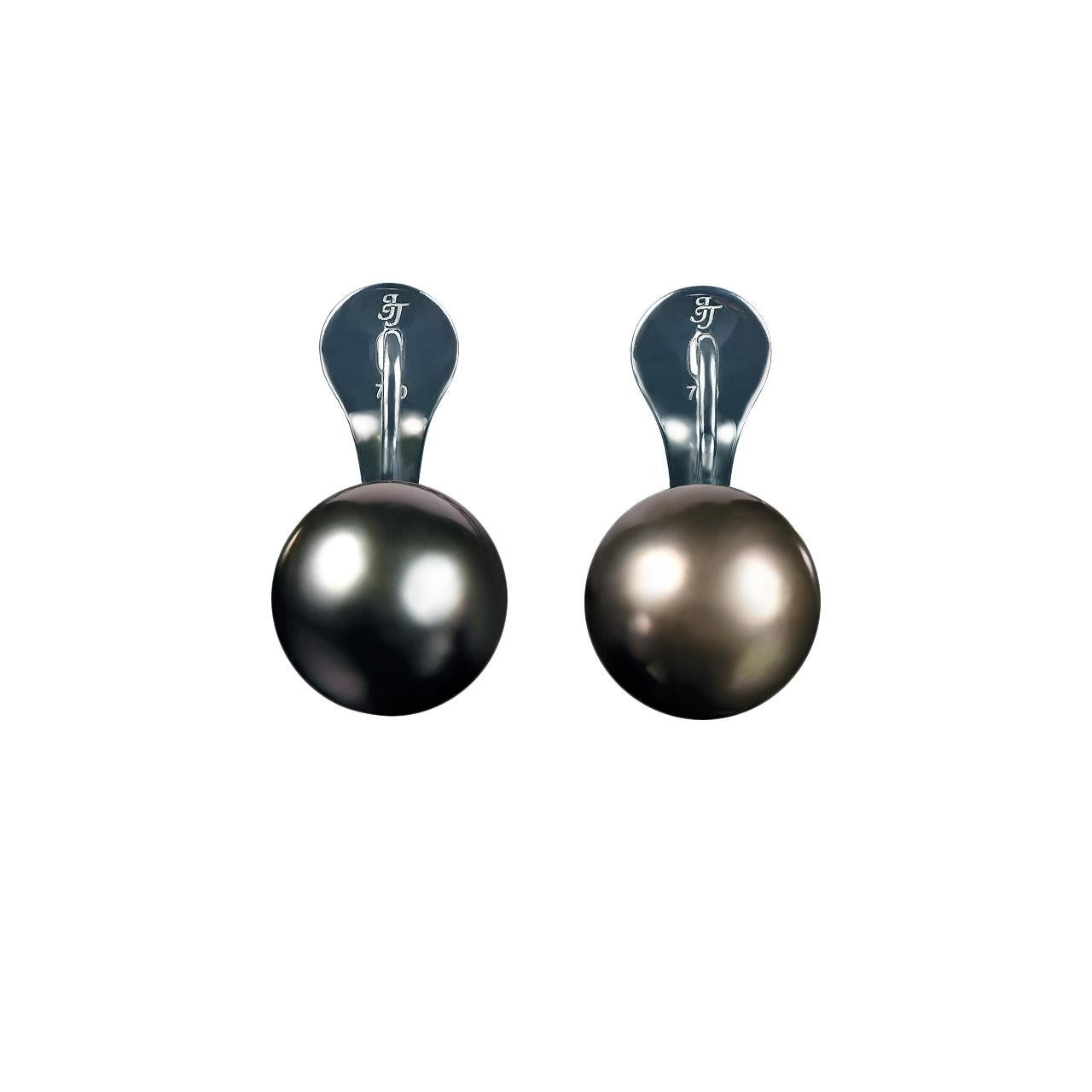 - 26 Round Diamonds – 0.10 ct, E-F/ VVS
- 28 Round Sapphires– 0.10 ct
- 43 Round Tsavorites– 0.14 ct
- 13.1-13.2 mm Dark Tahitian pearls 
- 18K White Gold 
- Weight: 11.09 g
Two perfectly matched lustrous Dark Tahitian pearls measuring 13.1–13.2