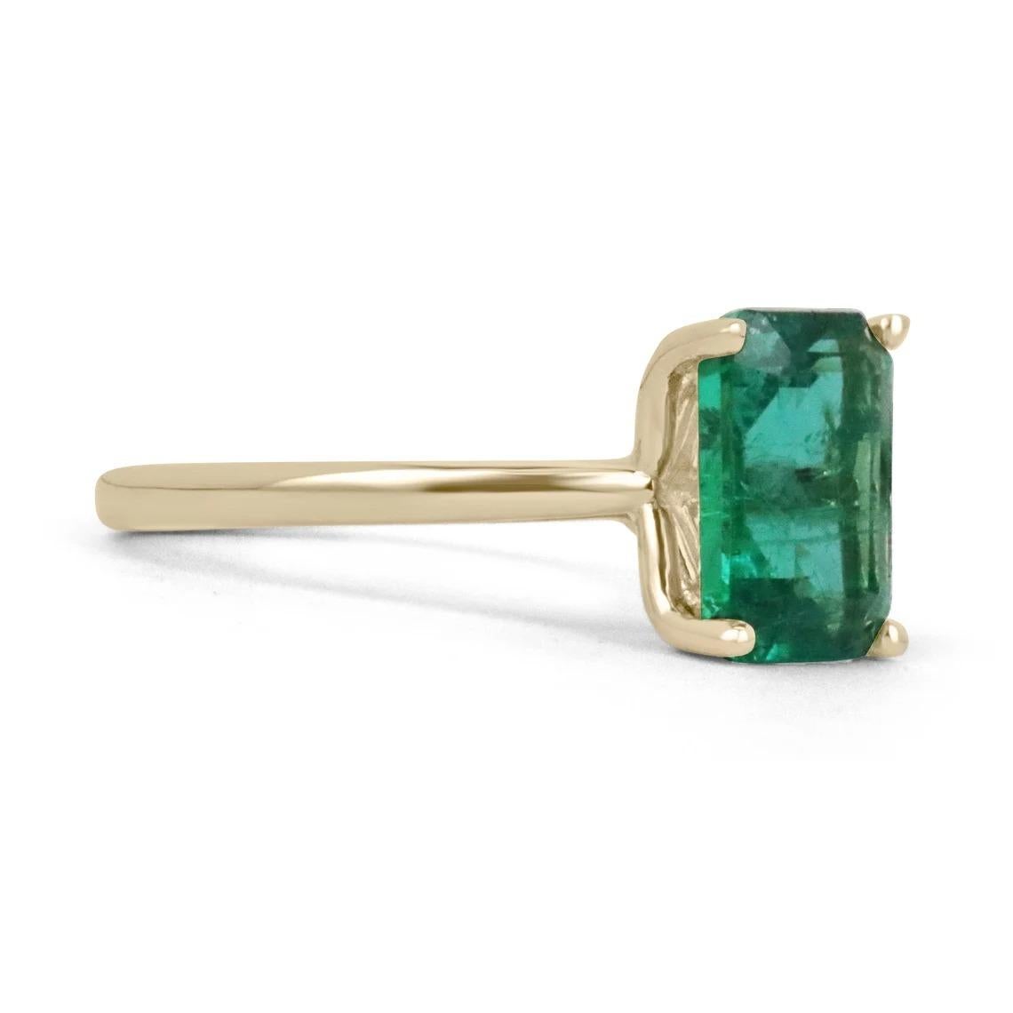 Displayed is a classic emerald solitaire engagement or right-hand ring. This spectacular piece features a remarkable 2.80-carat, natural emerald cut emerald from the origins of Zambia. The center stone showcases a rich, rare, dark vivid green color