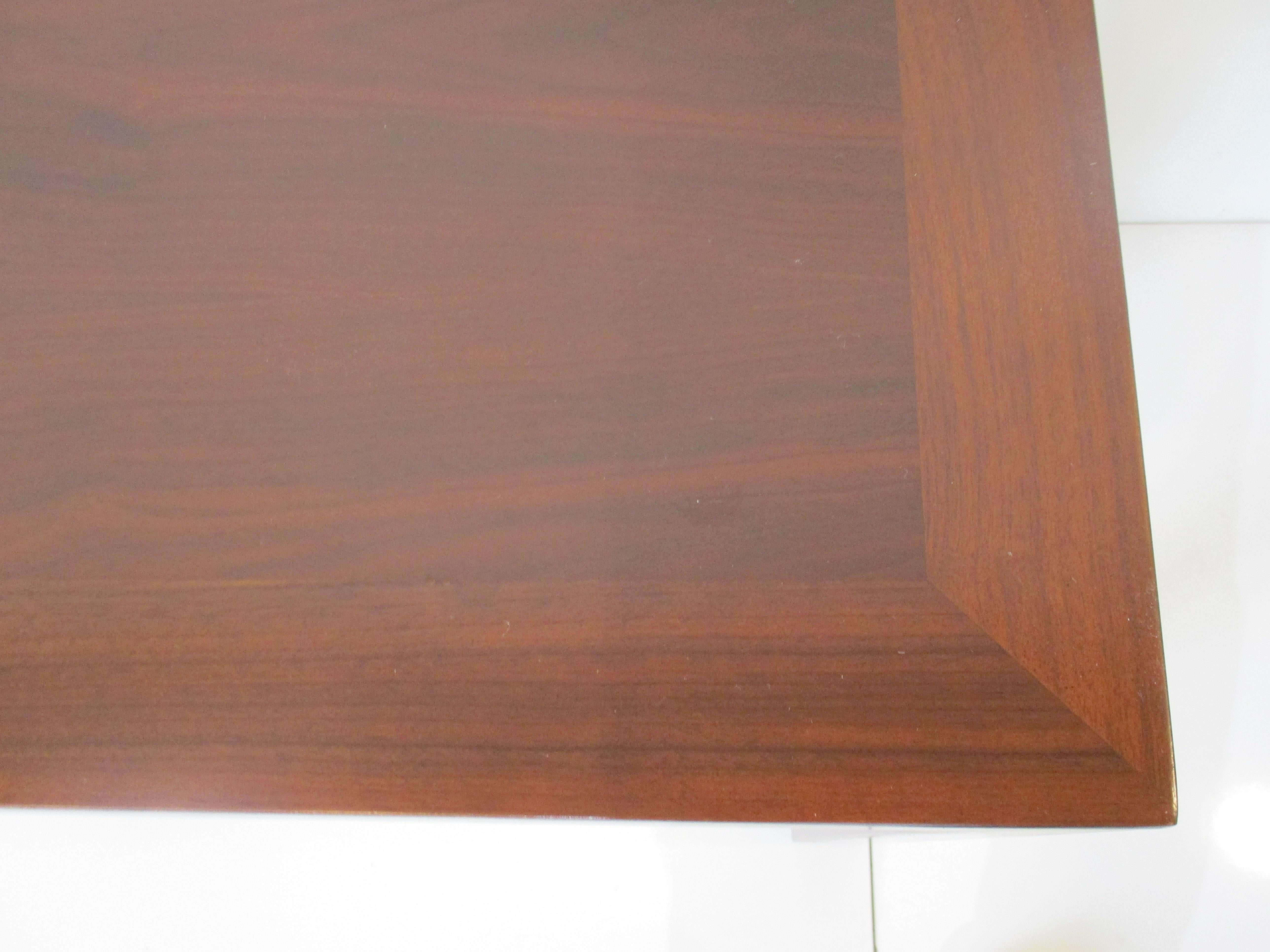 A very well crafted dark walnut console table with great graining and defined boarder to the top blending into the legs . Perfect for the entrance way , hall or as a sofa table manufactured by Lane Altavista , this is one of the nicest consoles I've
