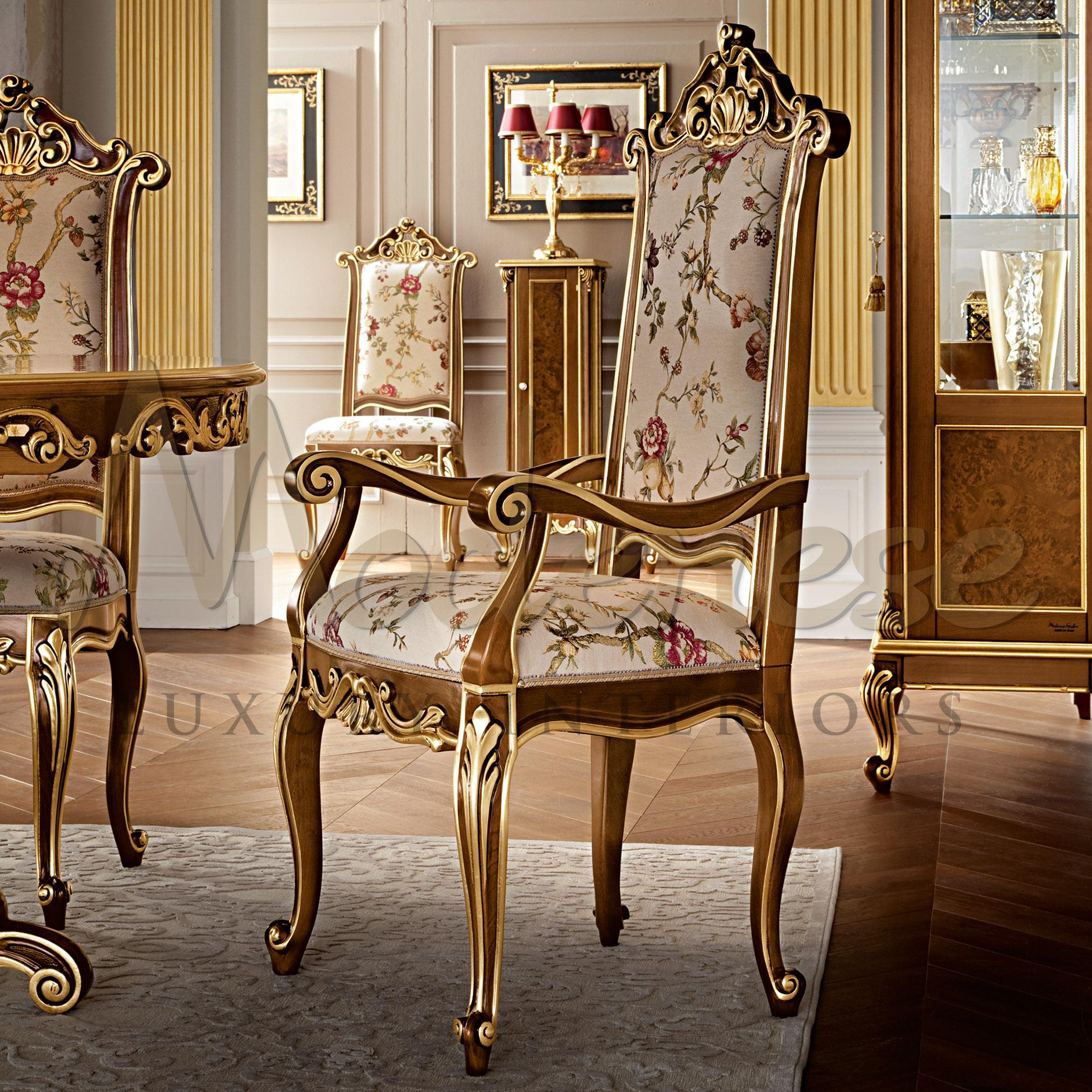 High-end palaces need high-end furniture, and the mission of Modenese Gastone Interiors is to serve this purpose. This majestic shiny dining chair with armrests presents a dark walnut finish with gold leaf applications along the carved lines, while