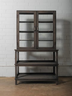 Dark Wood Glass-Front Cabinet on Tiered Open Base