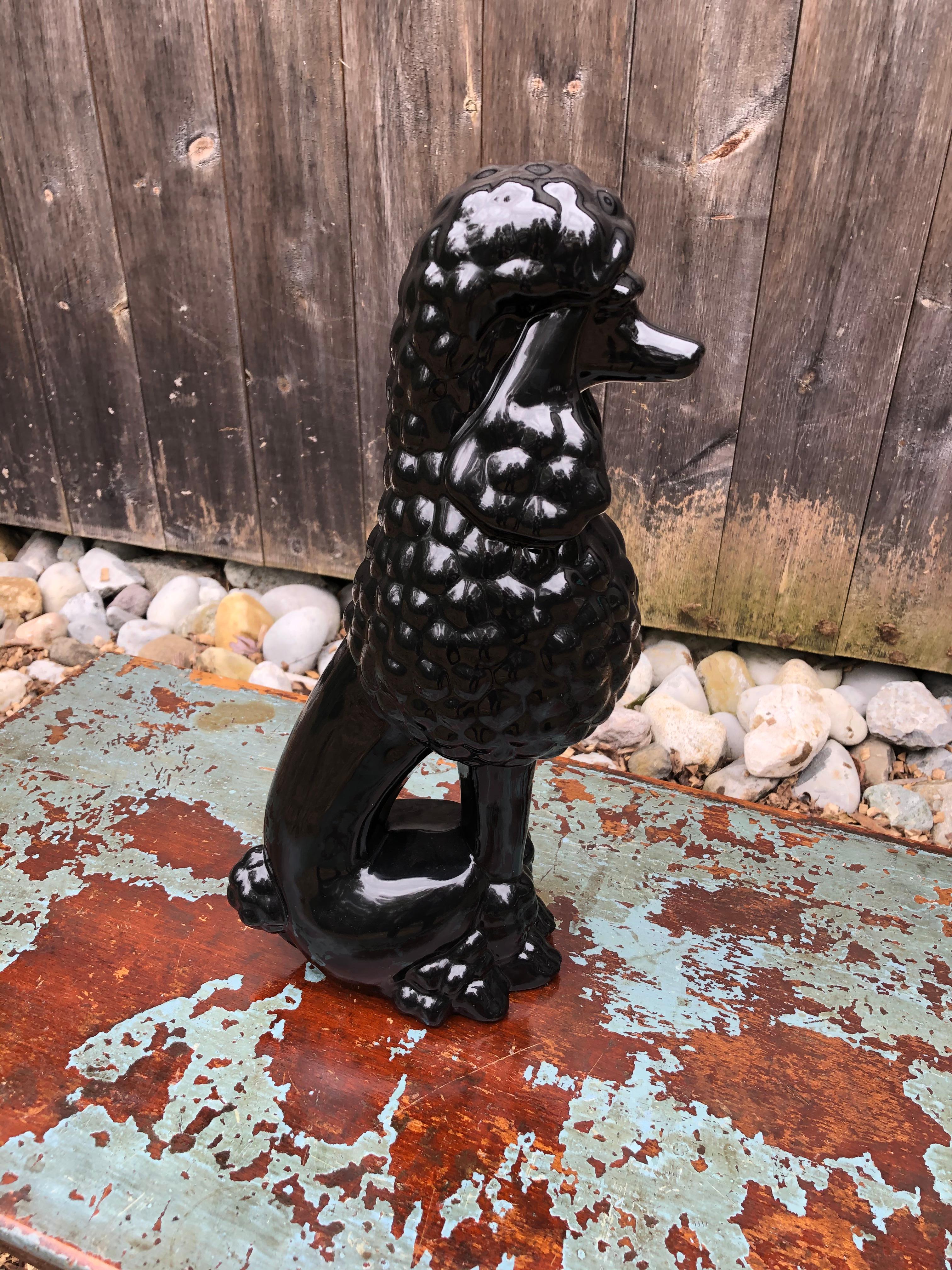 A large adorable vintage black porcelain poodle sculpture. Fun accessory!