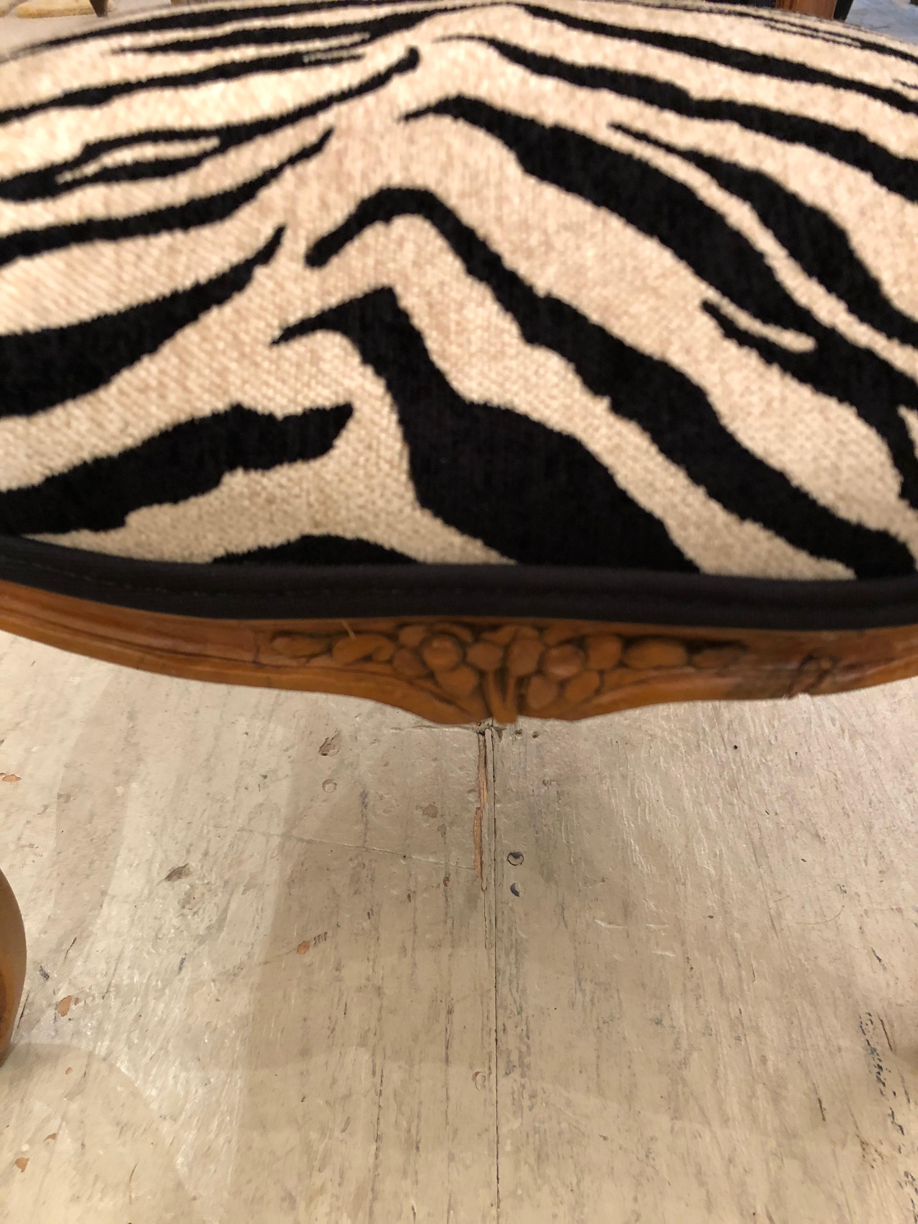 Diminutive vintage French armchair for a lucky child, having carved wood frame and new faux zebra chenille upholstery. Measures: seat height 12.