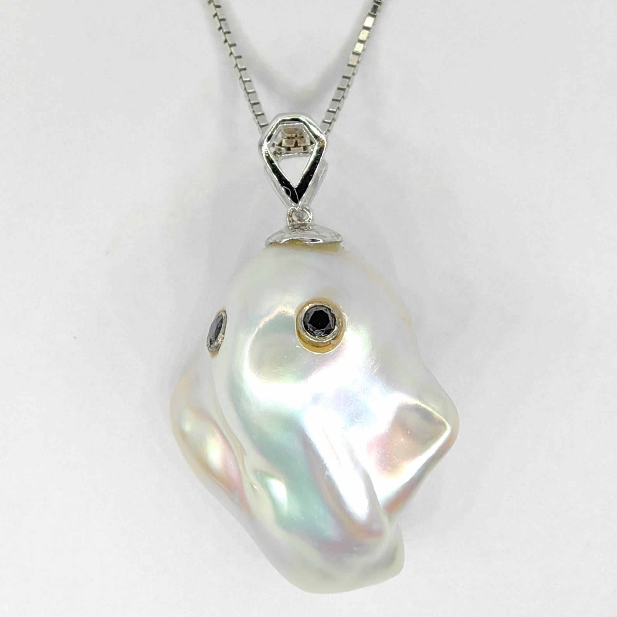Unveil the enchanting Darling Phantom: a whimsical marvel featuring a Black Diamond accented Baroque Pearl set in 18K White Gold, evoking the spirit of a friendly ghost. This adorable piece, with a pendant length of approximately 1.14 inches, is