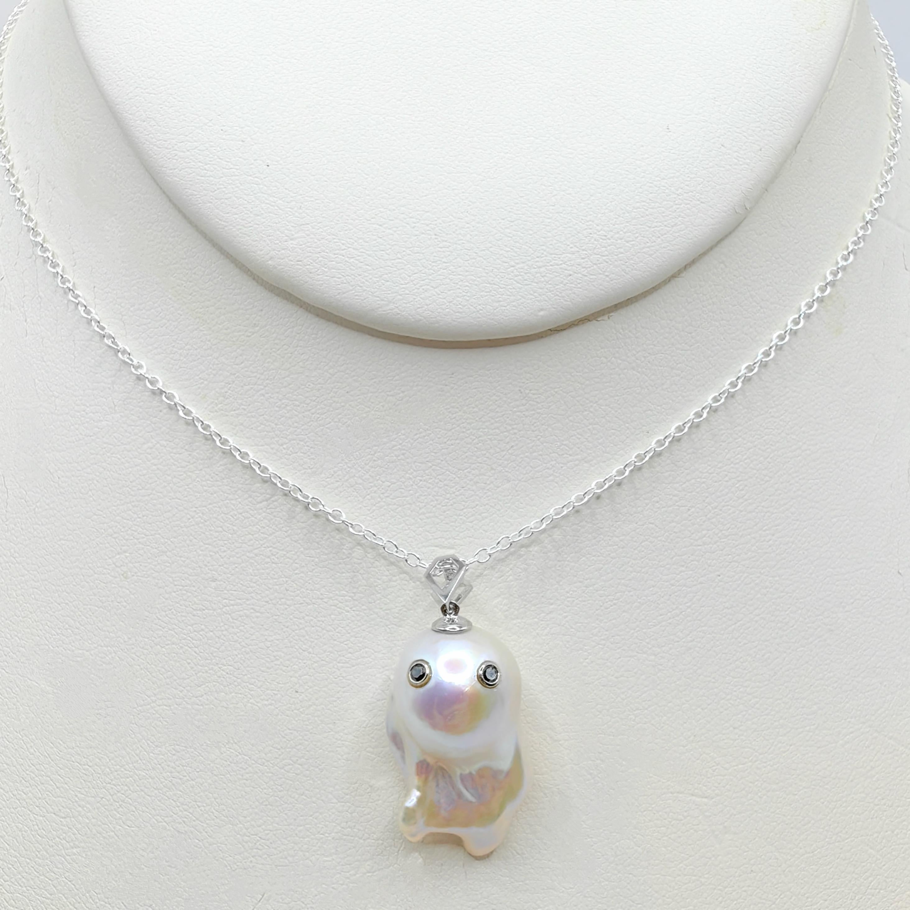 Unveil the enchanting Darling Phantom: a whimsical marvel featuring a Black Diamond accented Baroque Pearl set in 18K White Gold, evoking the spirit of a friendly ghost. This adorable piece, with a pendant length of approximately 1.28 inches