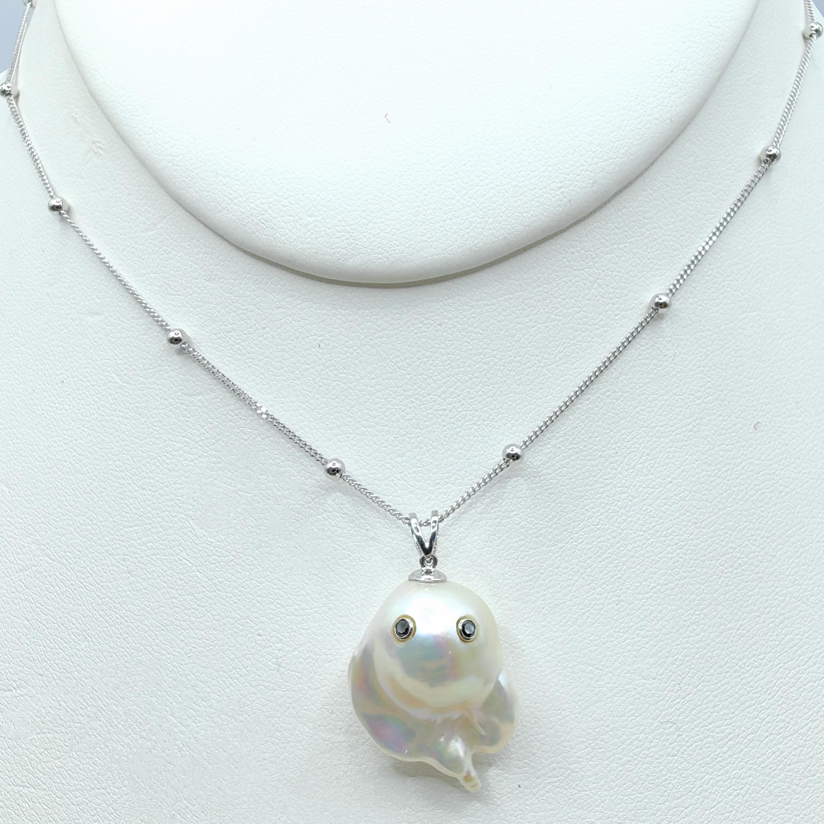 Unveil the enchanting Darling Phantom: a whimsical marvel featuring a Black Diamond accented Baroque Pearl set in 18K White Gold, evoking the spirit of a friendly ghost. This adorable piece, with a pendant length of approximately 1.18 inches (3.00
