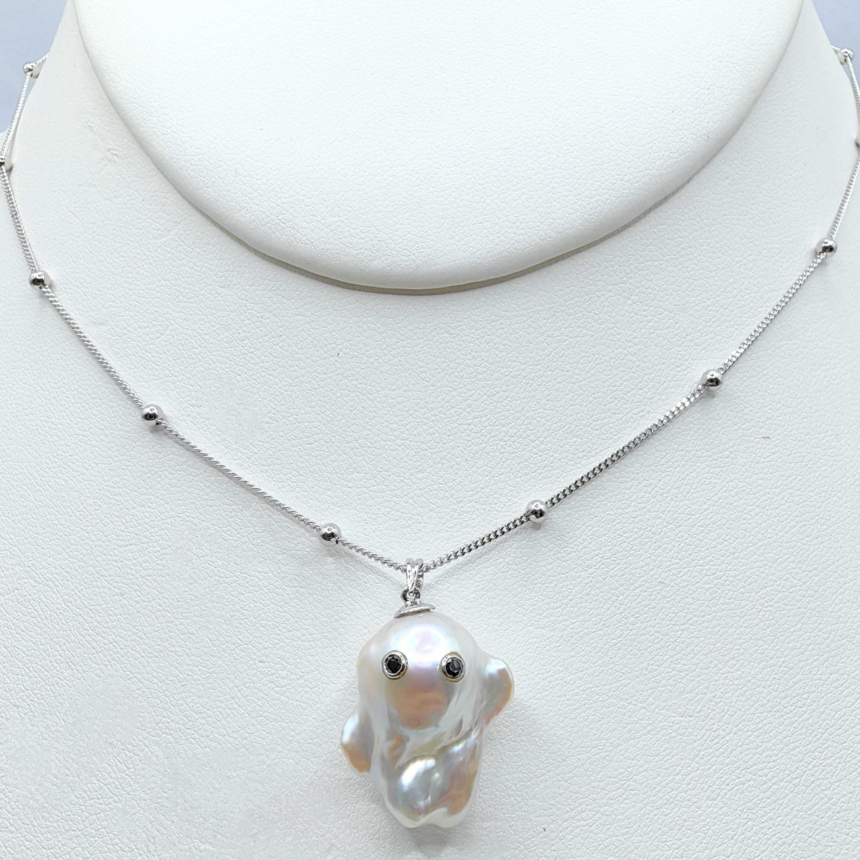 Unveil the enchanting Darling Phantom: a whimsical marvel featuring a Black Diamond accented Baroque Pearl set in 18K White Gold, evoking the spirit of a friendly ghost. This adorable piece, with a pendant length of approximately 1.05 inches