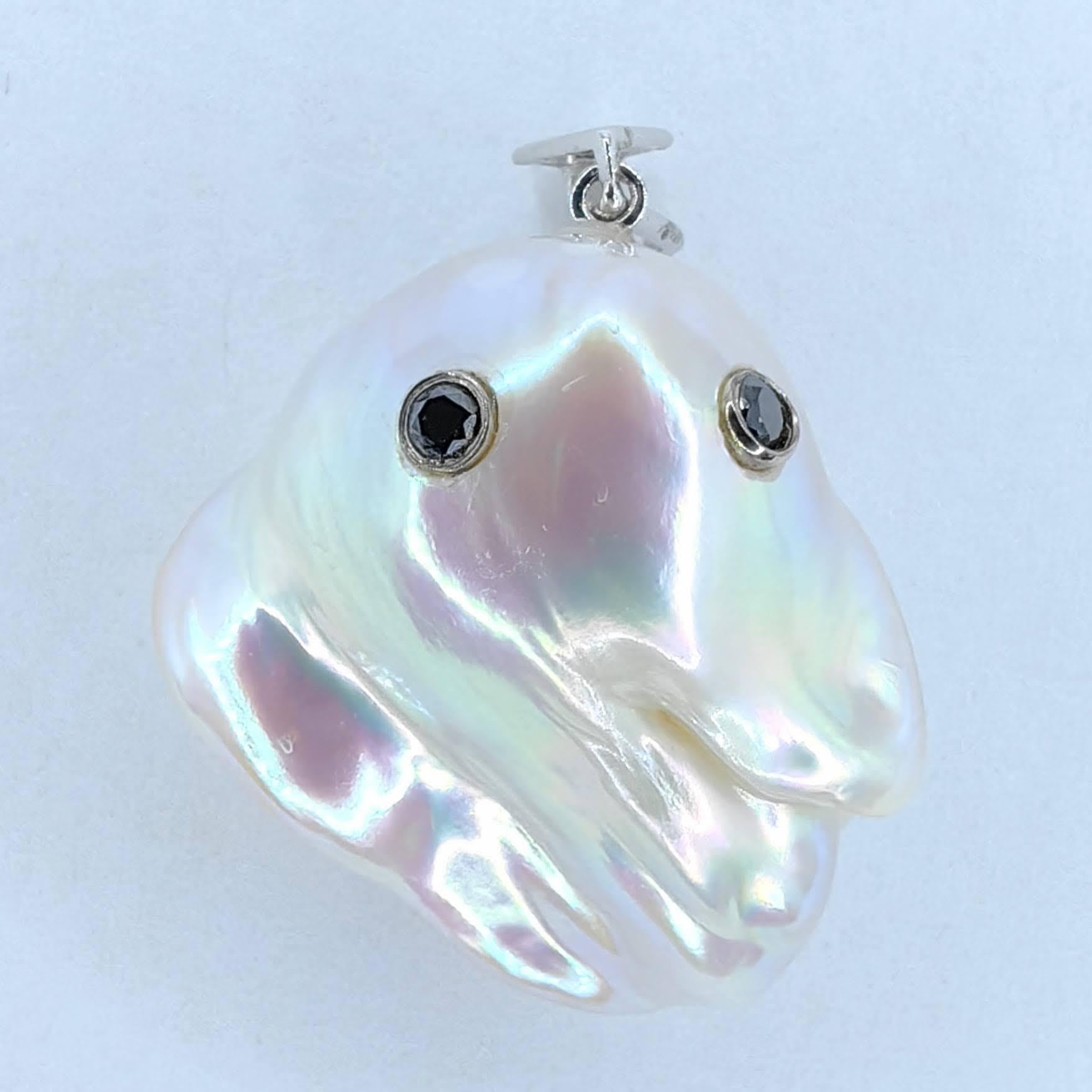 Unveil the enchanting Darling Phantom: a whimsical marvel featuring a Black Diamond accented Baroque Pearl set in 18K White Gold, evoking the spirit of a friendly ghost. This adorable piece, with a pendant length of approximately 1.09 inches (2.78