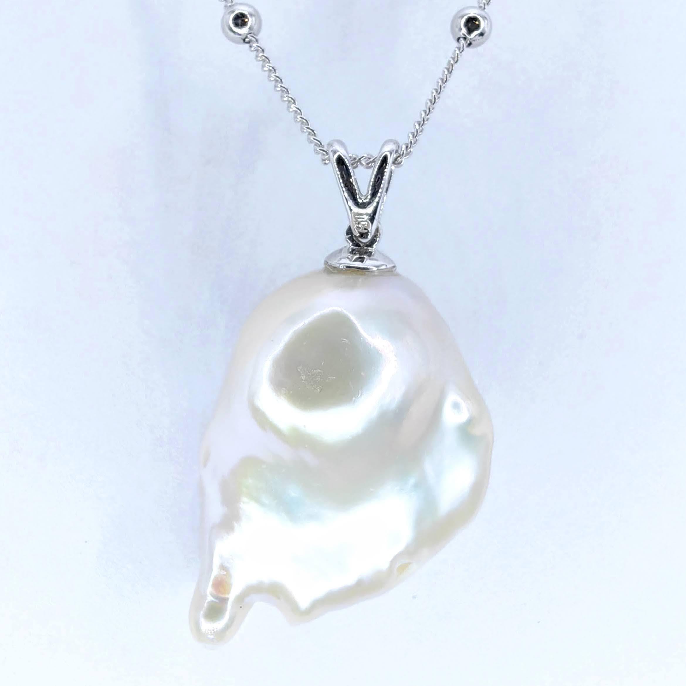 Unveil the enchanting Darling Phantom: Orange Sapphire White Baroque Pearl Ghost Pendant 18K White Gold, evoking the spirit of a mischievous yet charming ghost. This captivating piece, with a pendant length of approximately 1.16 inch (2.94cm), is