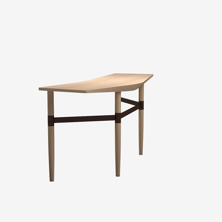 This Darling point desk by Yabu Pushelberg in nude brushed ultra matte lacquered oak is paired with a Golden or Bronze coloured brass frame structure.

Yabu Pushelberg’s design for the darling point desk is hand-hewn by craftsmen from sustainably