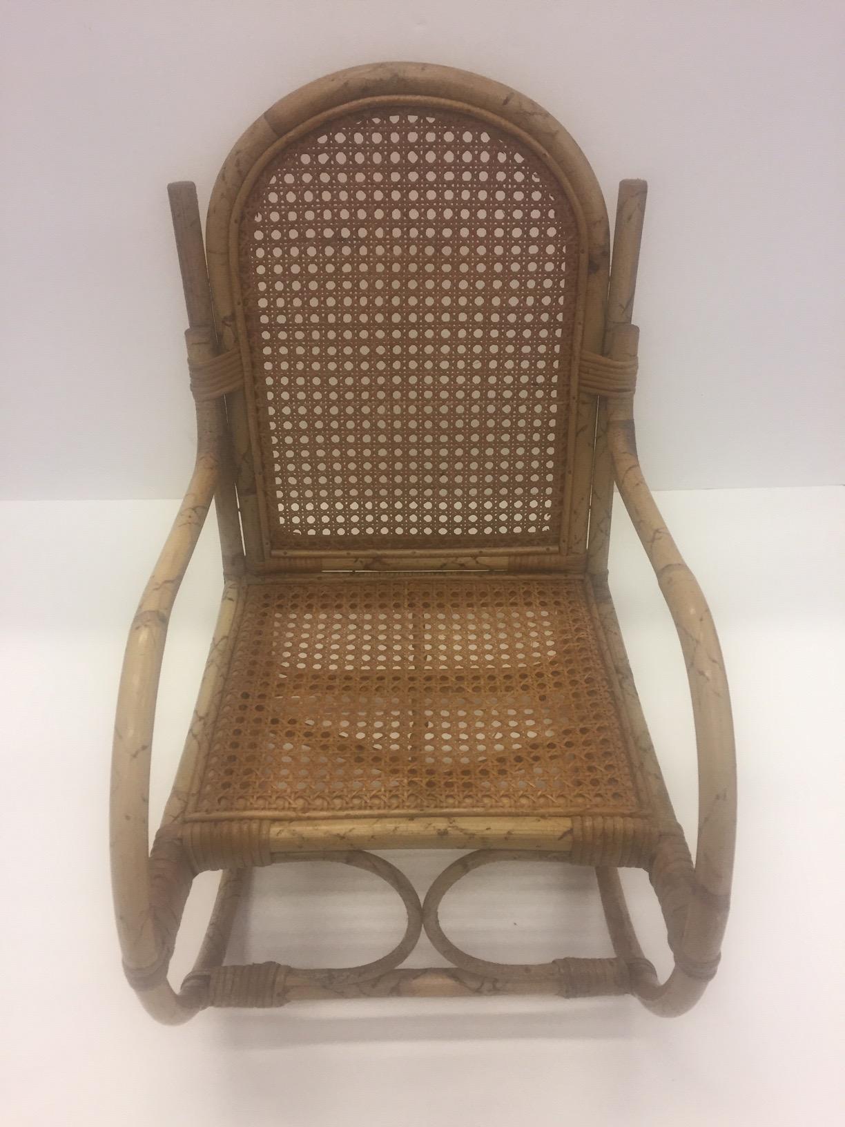 A pint sized rattan rocking chair for a lucky kid.