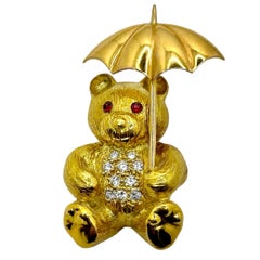 Gold Teddy Bear Pin on a Rainy Day with Diamonds & Rubies by E. Wolfe & Co.