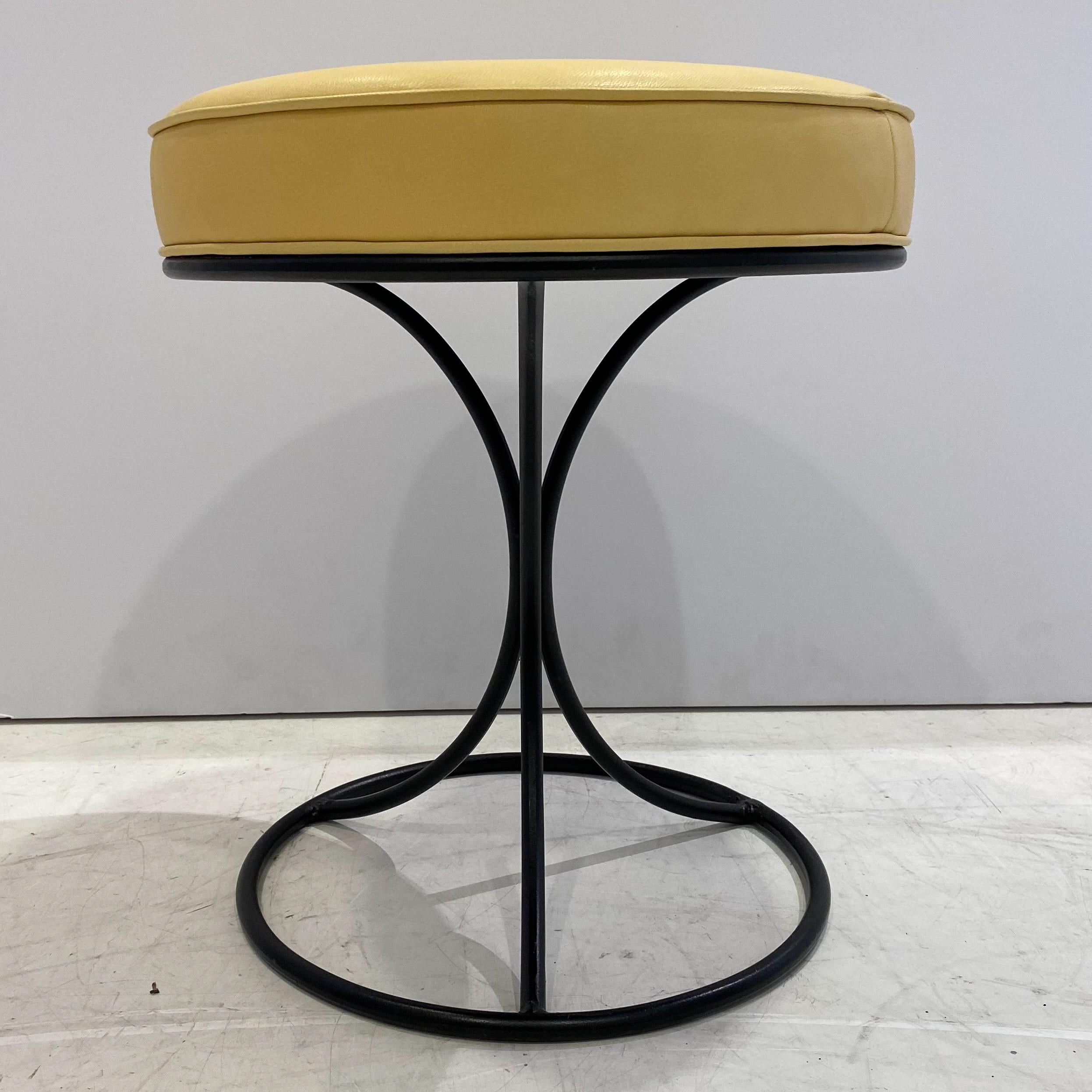 Low stool or footrest with repainted extruded steel base and cushion reupholstered in yellow leather. A rarely seen midcentury design by Darrel Landrum, produced by Avard Furniture.