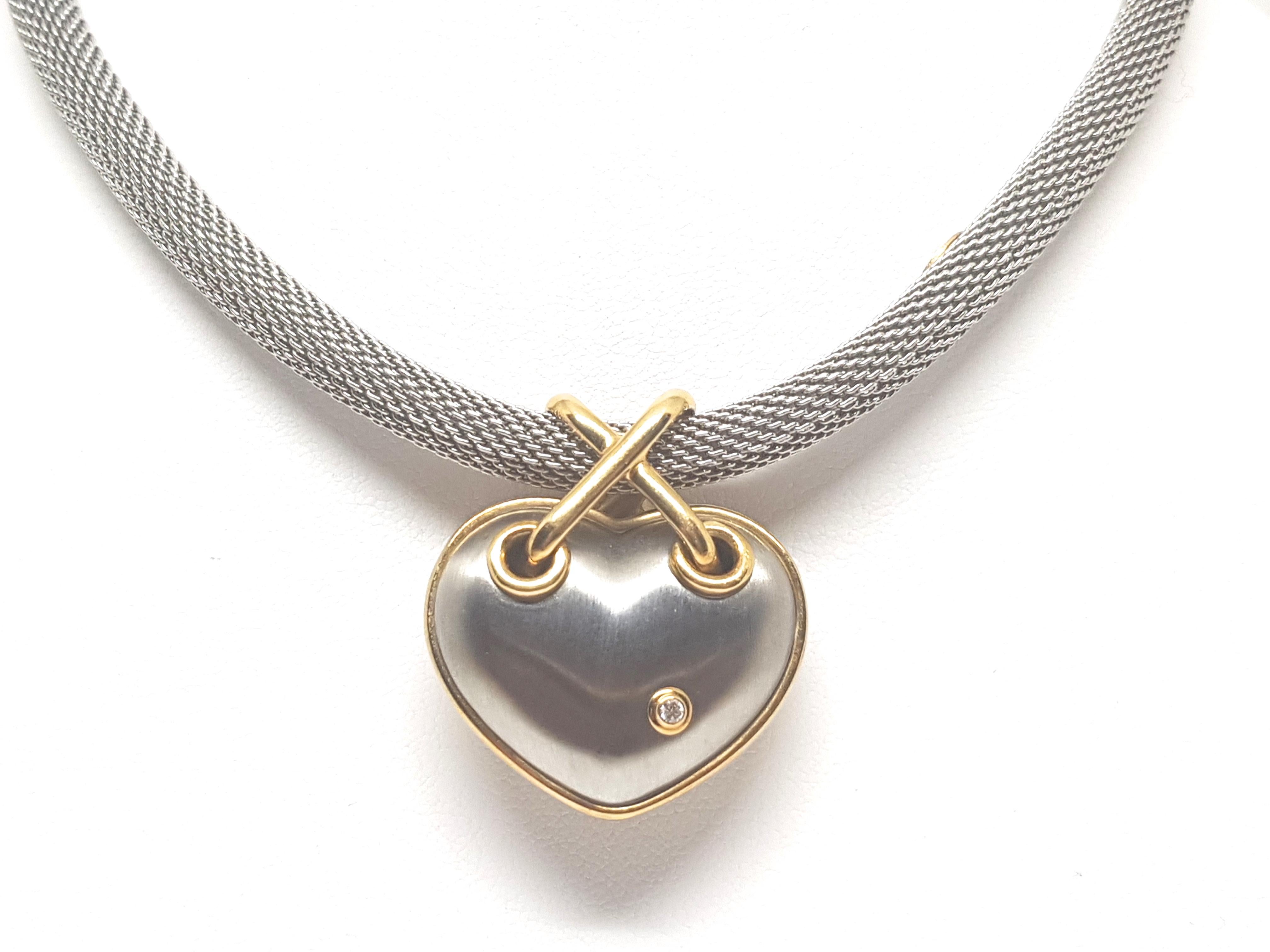Signed Darsy 750 
Gold: 18 Carat Yellow Gold / Stainless Steel 
Necklace and Pendant made out of Stainless steel and gold accents in 18K Gold 
Weight: 50.44 gr. 
Diamond: 0.07ct. D / IF 
Length Necklace: 45.0cm. 
Width Necklace: 0.6 cm. 
All our