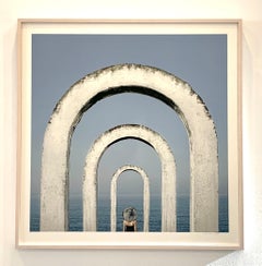 Color Photograph, Woman Figure, ocean, white architectural arches, horizon