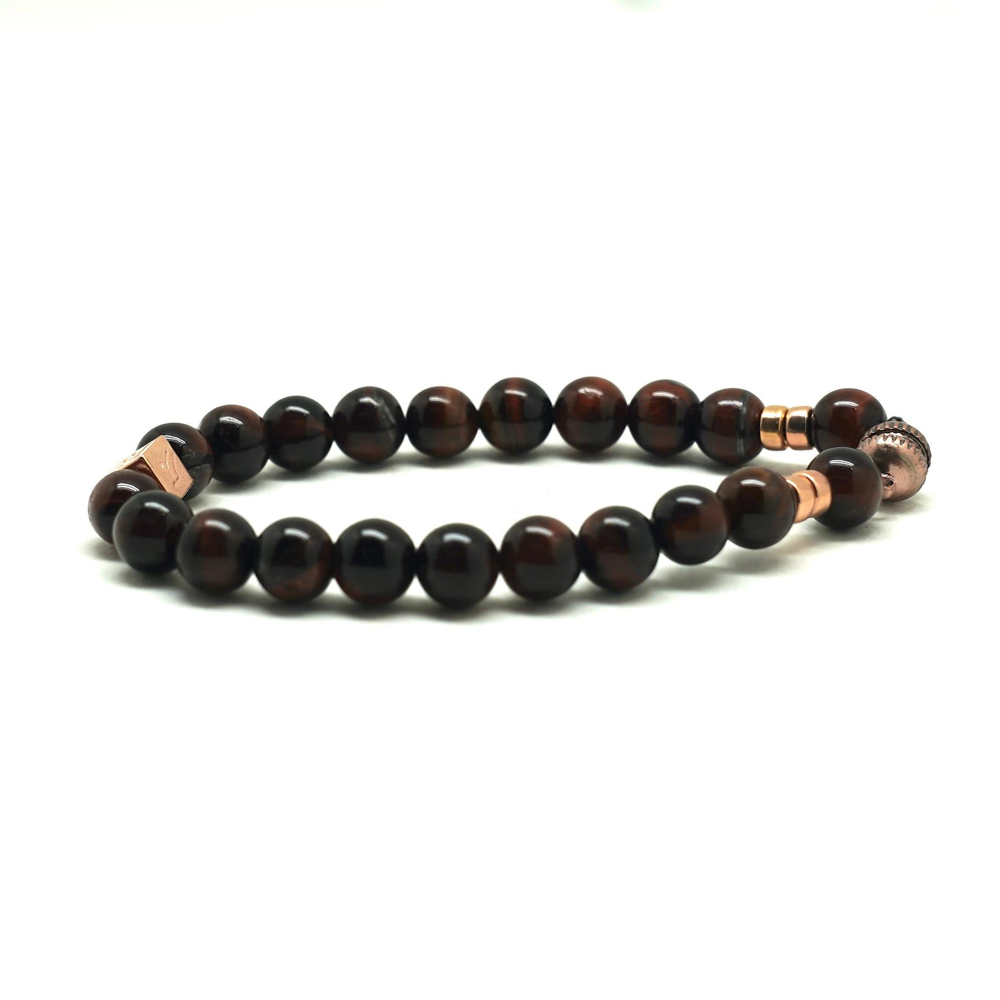 Story Behind the Jewelry
The magnetic clasp and mahogany Tiger's Eye stones on this bracelet are accented with 14K rose gold to create a robust gentlemanlike look that would enhance any outfit. The smooth and elegant beads known as the 