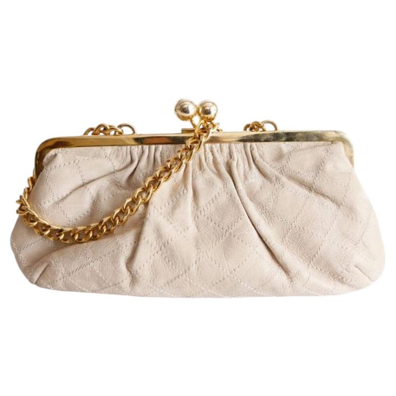 Daslu, pochette portefeuille en cuir matelassé beige