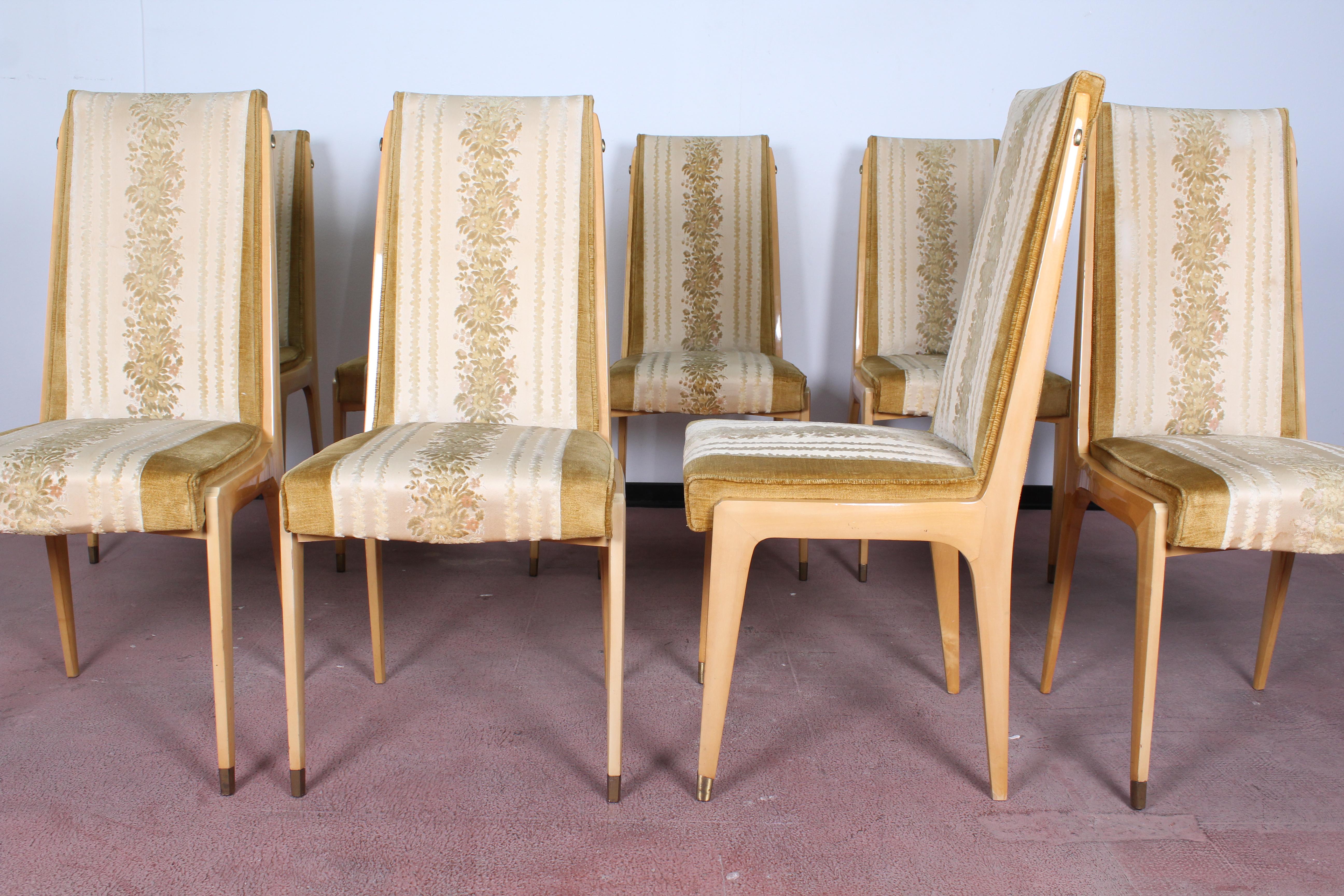 Set of eight dining table chairs by Vittorio Dassi, Italy, 1950 circa.
The wooden frame, which is very typical of the design of furniture by Dassi, it's in maple, with brass feet.
Measures: Height 100 cm, seat width 50 cm, seat depth 47 cm, seat