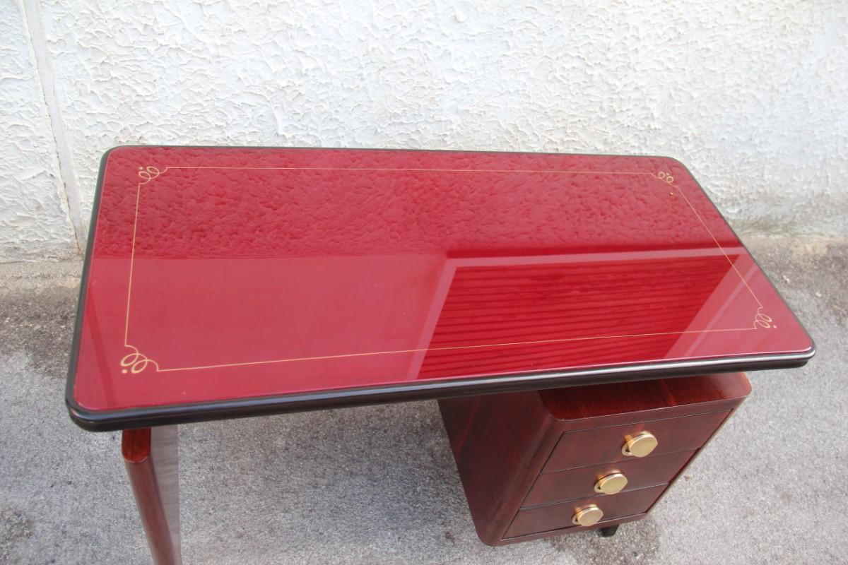 Dassi small desk rosewood Mid-Century Modern brass minimal scultural 1950s Italian.
Colored glass top with gold decorations on the edge.
Perfectly restored.