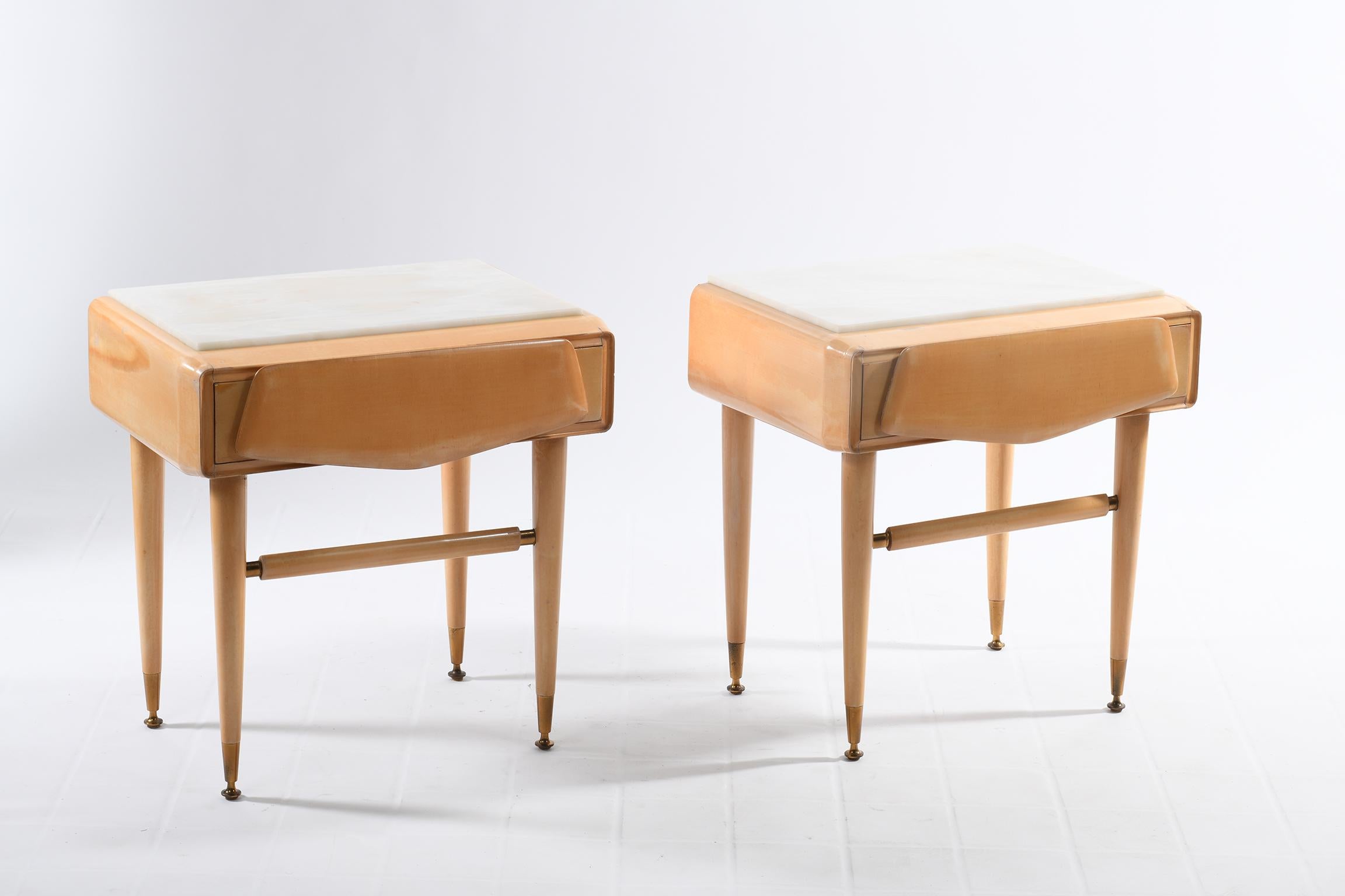 Pair of bedside tables in bleached solid maple with beautiful details in cast brass, white marble top.
Made by the company Dassi Lissone Milan Italy in the 1950s, these bedroom tables or side tables have a shaped drawer carved in solid wood. 
 