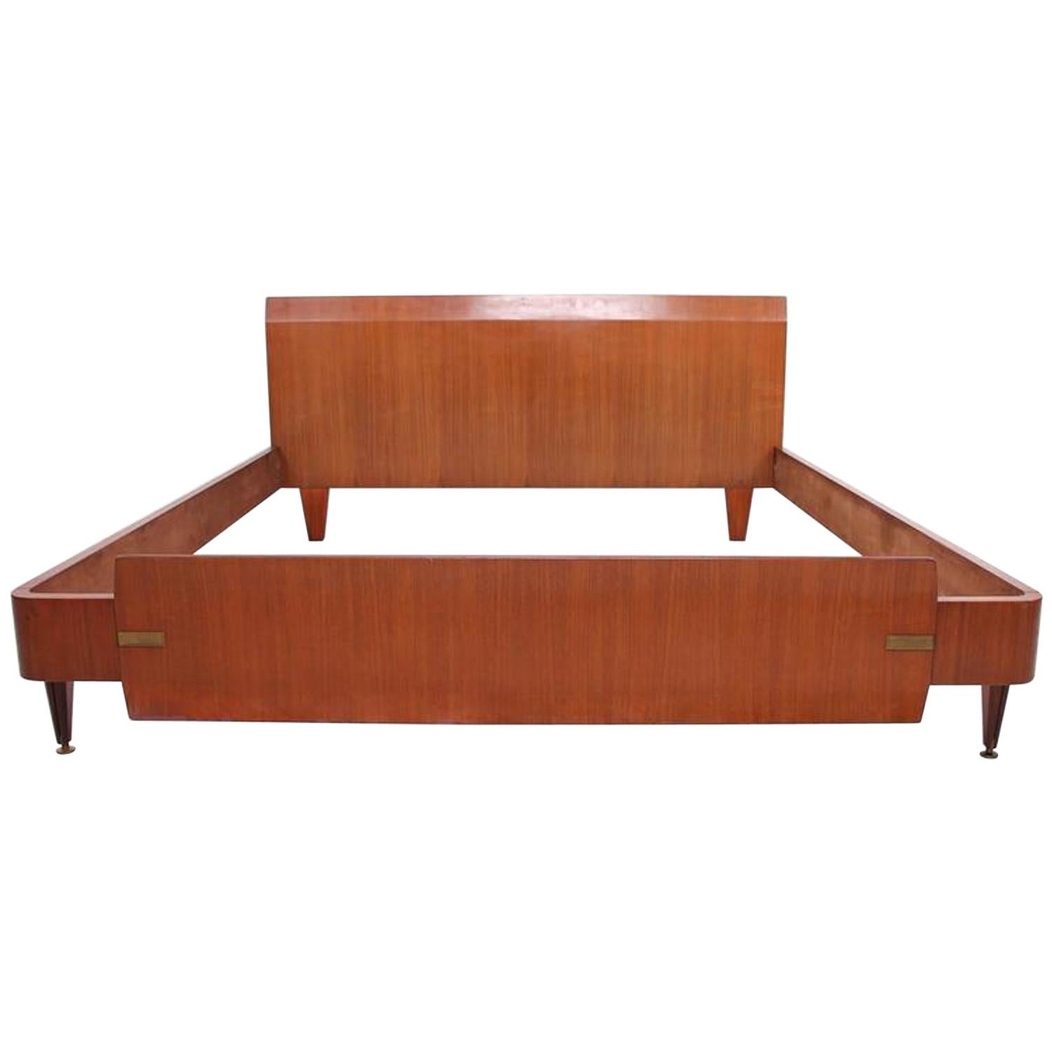 Bed
MCM Italian Wood custom King Bed Frame geometric angles in mahogany sapele wood with brass detail ITALY
Attributed to Vittorio DASSI in the style of Gio Ponti. Unmarked.
H 30 in. x W 77 in. x D 80 in. 
Original unrestored vintage condition. Very
