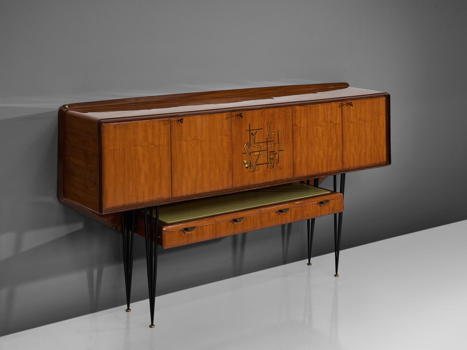 Sideboard, Italian wood and brass for Dassi, Italy, 1960s.

Delicate Italian cabinet unit in the style of Ico Parisi, Paolo Buffa and Vittorio Dassi on high tapered legs which are connected via a horizontal element featuring four separate drawers.