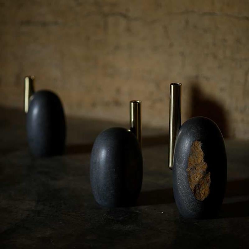Daté Kan stone candleholders by Okurayama Studio and Dan Yeffet
Title: GOLDEN ‘MENHIRS’
Measures: Large F 130 x H 320mm / 6.7kg
Medium: F 120 x H 245mm / 4.4kg
Small: F 107 x H 175mm / 3.5kg
Daté Kan stone, brass
GOLDEN ‘MENHIRS’
A