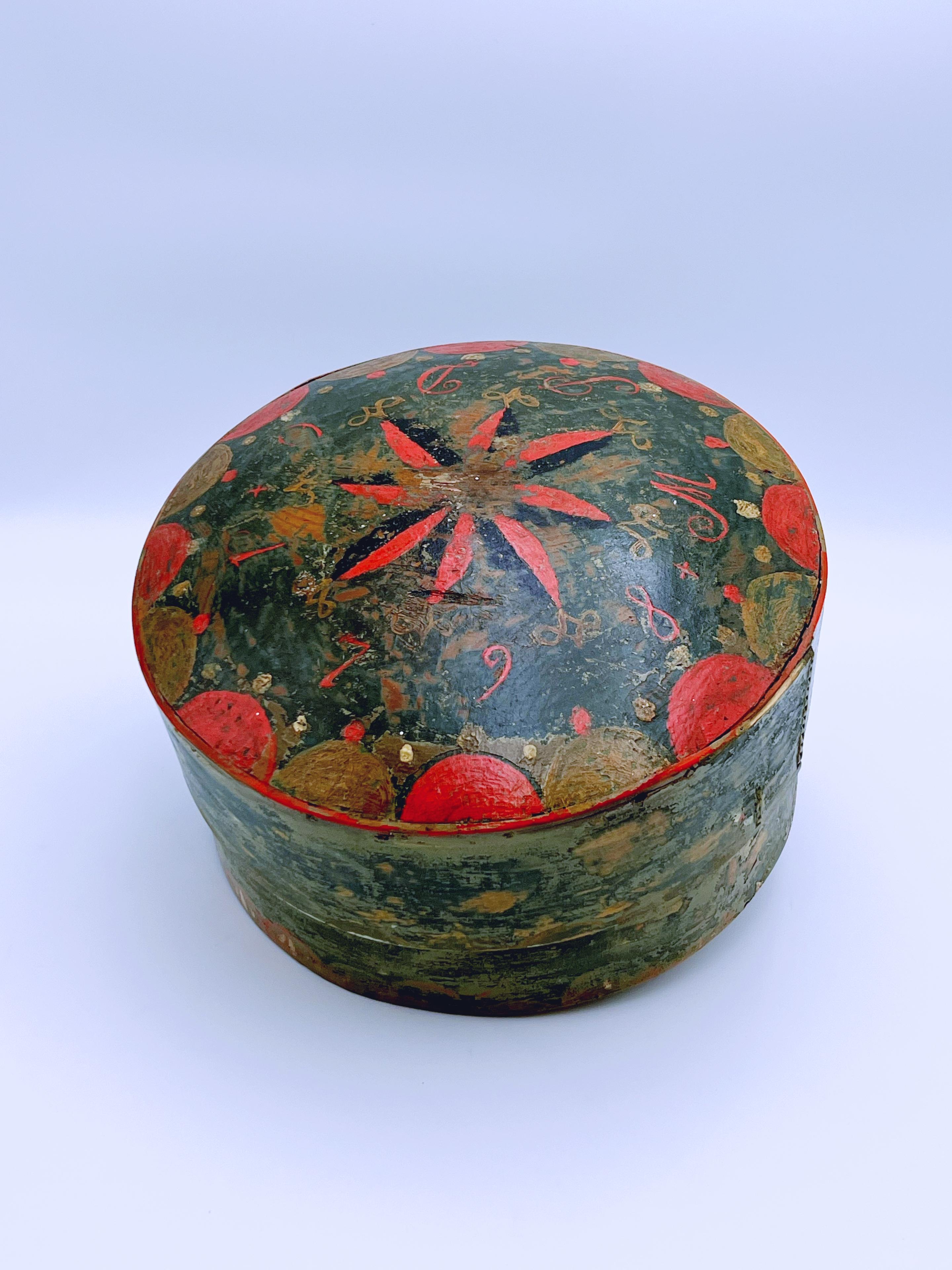 A museum-quality primitive antique tine of exceptional rarity, handcrafted in Norway's Trøndelag region in 1798. Representing the pinnacle of Scandinavian folk art, this pine box was a functional storage piece, now preserved as a significant