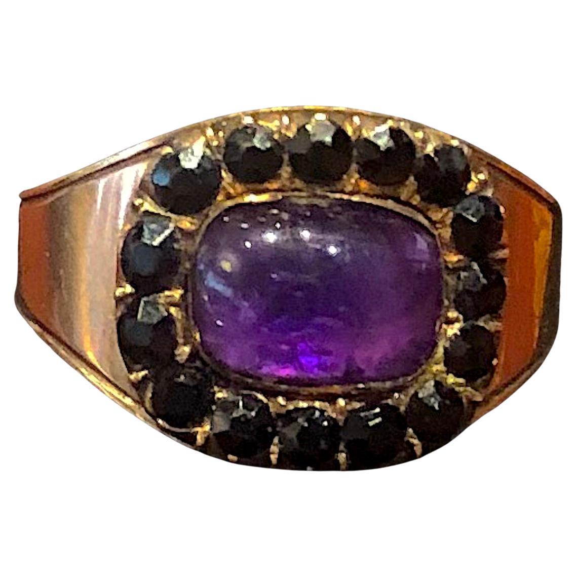 This Georgian memorial ring commemorates the death of JAMES YOUNG who DIED 24 AUGUST 1808, AGED 64.  It consists of a 1 carat cabochon amethyst surrounded by small jets.
Likely this ring was gifted to one of James Young's Pall Bearers as was the
