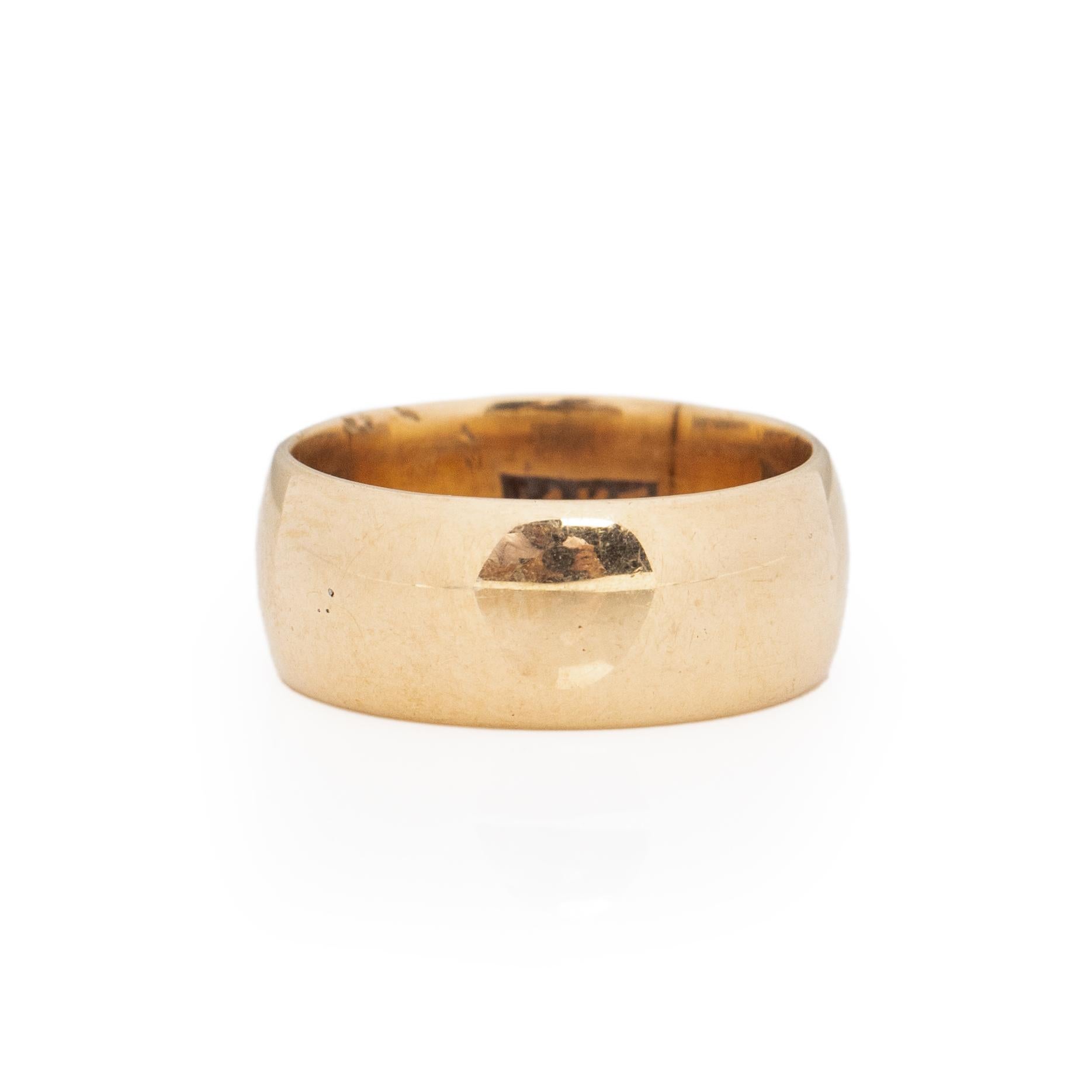 Here we have a classic smooth finish wide band, this piece is timeless and versatile. Crafted in 14K Yellow Gold this band would be a wonderful addition to a vintage ring collection, stacked with other bands or worn alone. Pairing with wide design