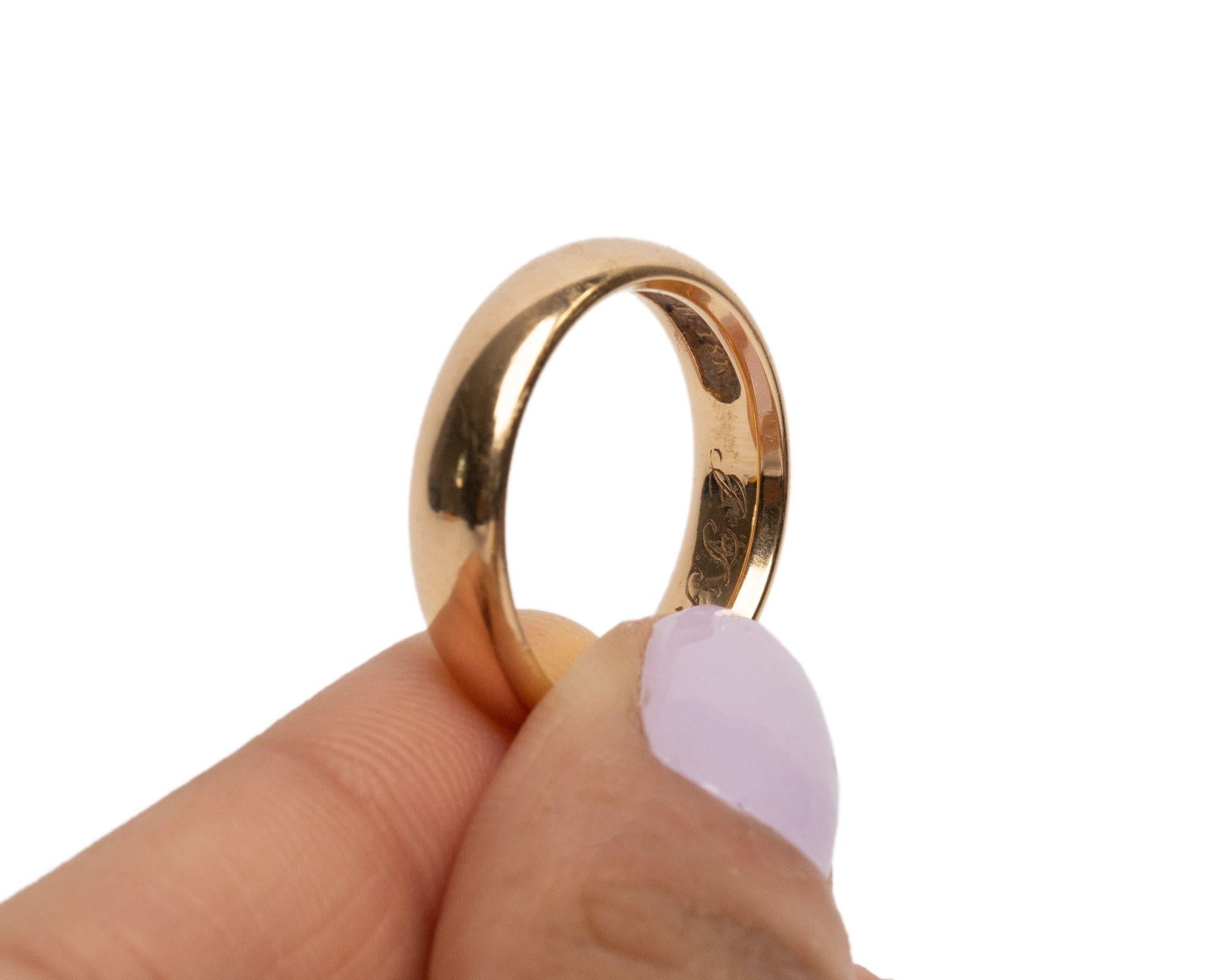 This beautiful unisex Edwardian band was made in America in 1911. This smooth 18K yellow gold antique band is a classic with engraving on the inside telling a sweet story of the past,  an eye catcher for the hopeless romantic. This piece of history