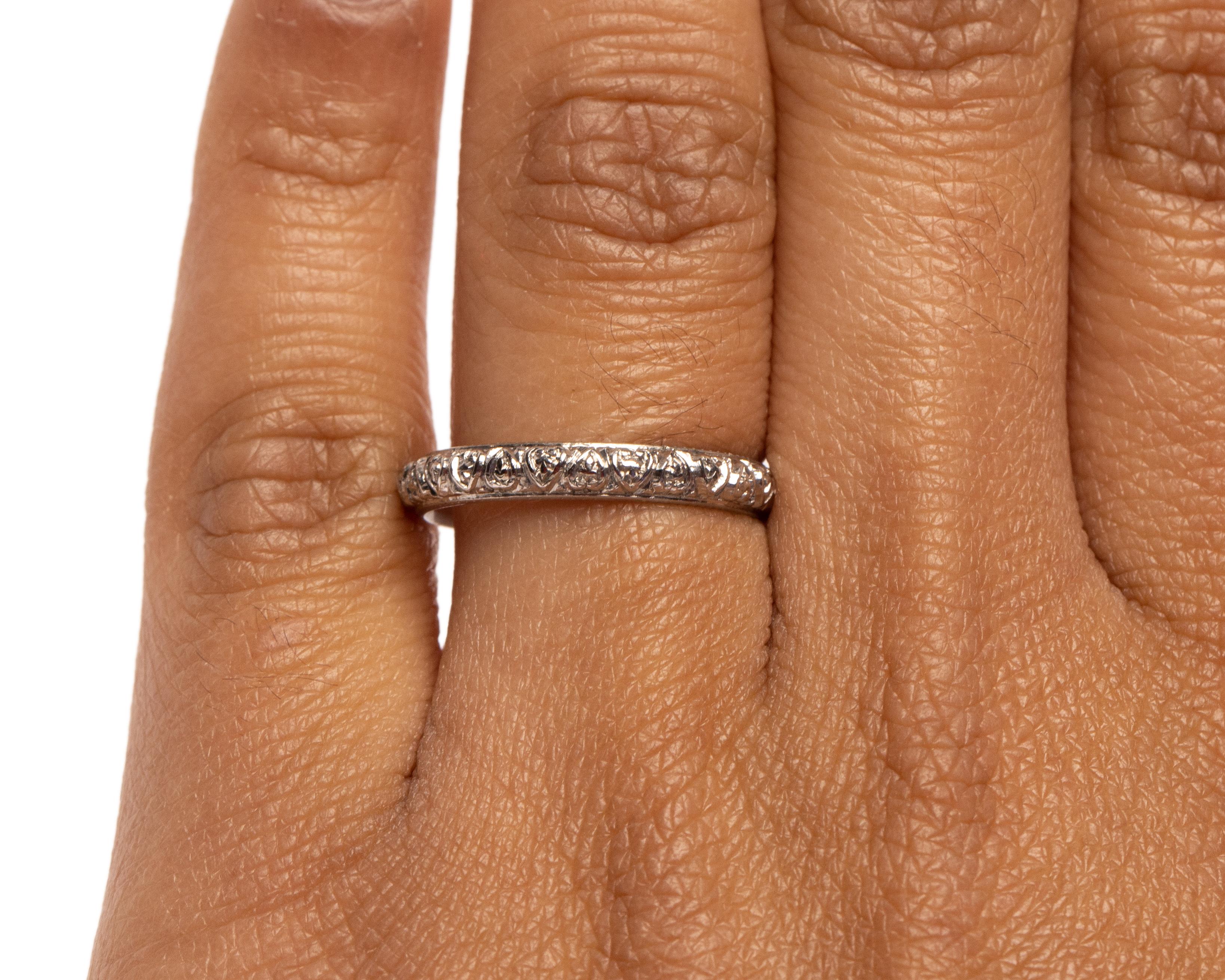 This band we have here is a perfect example of the Edwardian style, and for its age it is in beautiful condition. Crafted in platinum this band features an heart shape design repeating all of the way around the band. A thin line of milgrain frames