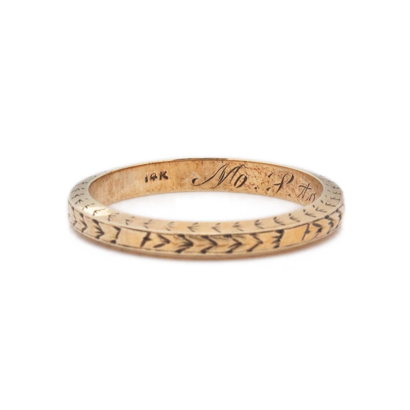 Here we have a great example of the art deco style, this band is crafted in 14K yellow gold. With a simple chevron or breaded design, keeping the look simple and versatile. Along with the deep relief engraving, this piece has a great personalization