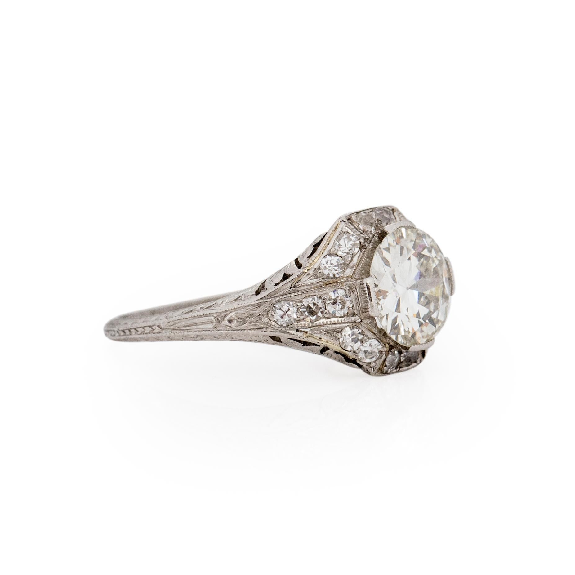 There we have a breath taking art deco piece. Rings with this diamond size and in this condition are getting harder and harder to come by. Set in platinum, the center 1.55 Ct old European cut diamond has facets that catch the light at every flick of