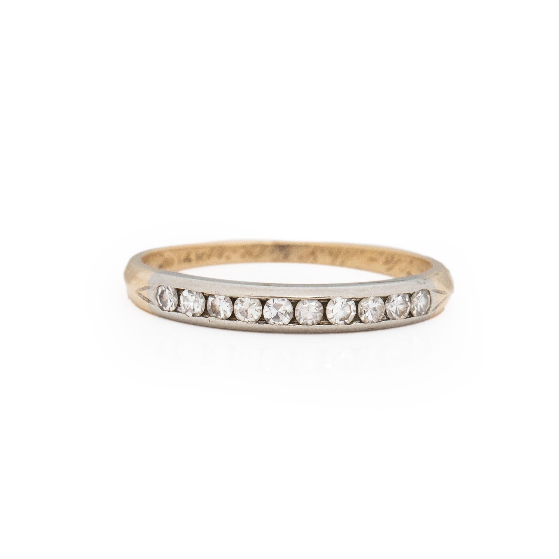 This beautiful little band is a timeless vintage piece. Crafted in 14K yellow gold with a white gold channel holding the diamonds this piece will look great paired with a vintage engagement ring or any style. Engraved with initials and a forever