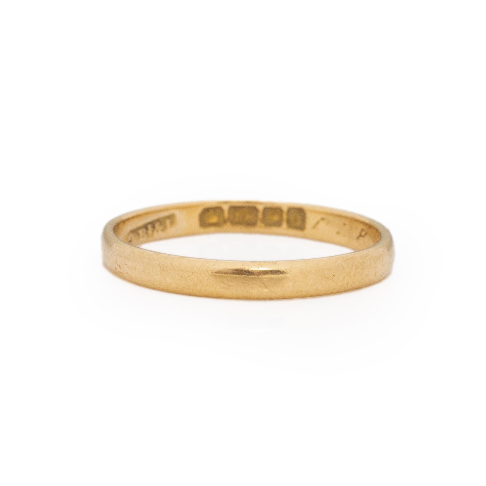 This antique little beauty is truly unique. This dainty little band looks simple on the outside, but on the inside of the band there is a beautiful story or two. Starting with the British hallmarks first we have the crown and an 18 the crown stamp