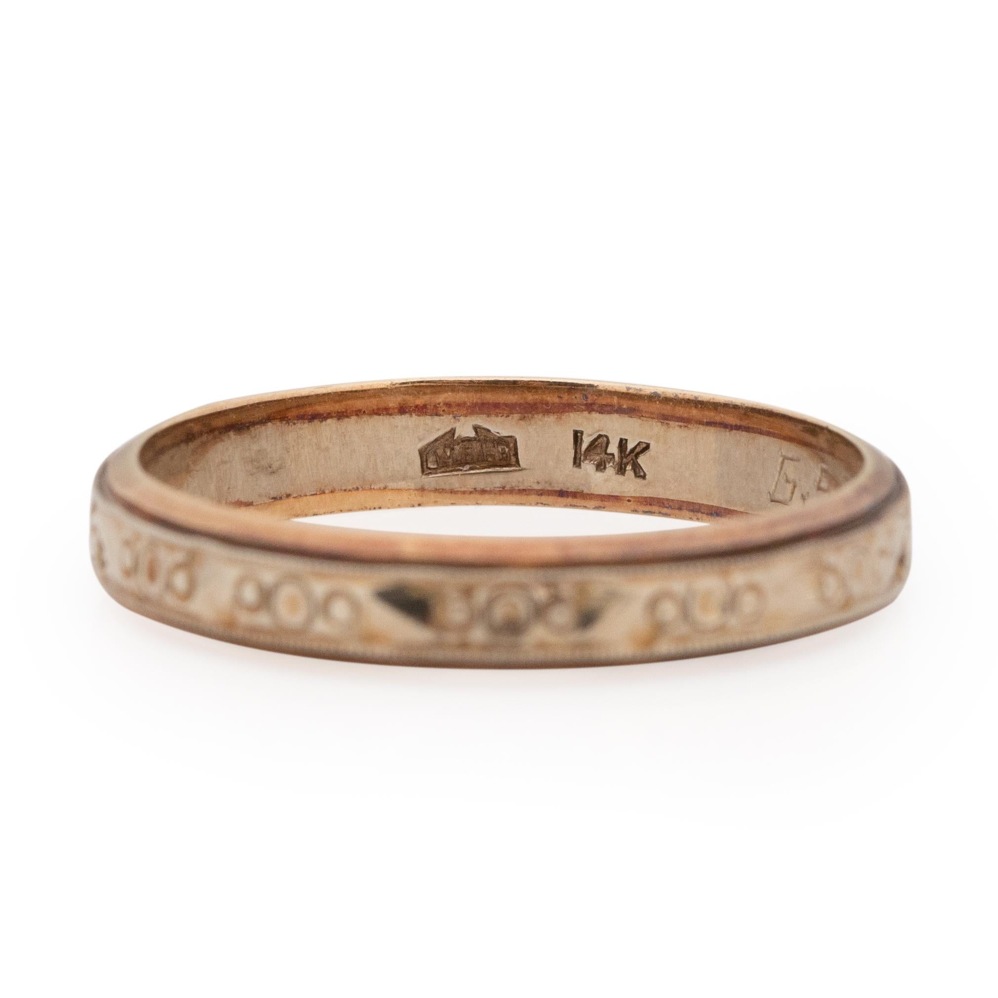 Here we have a beautifully carved geometric pattered unisex stackable wedding band. The center of this ring is 14K white gold, along either side of the white gold band is rose gold borders. The circle carved details are timeless, and versatile. To