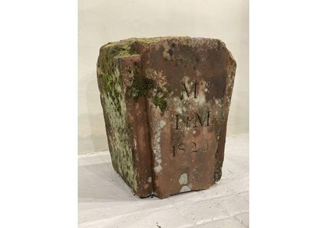 A rare 1825 dated keystone, with the initials M I M. Carved from red lazonby sandstone.