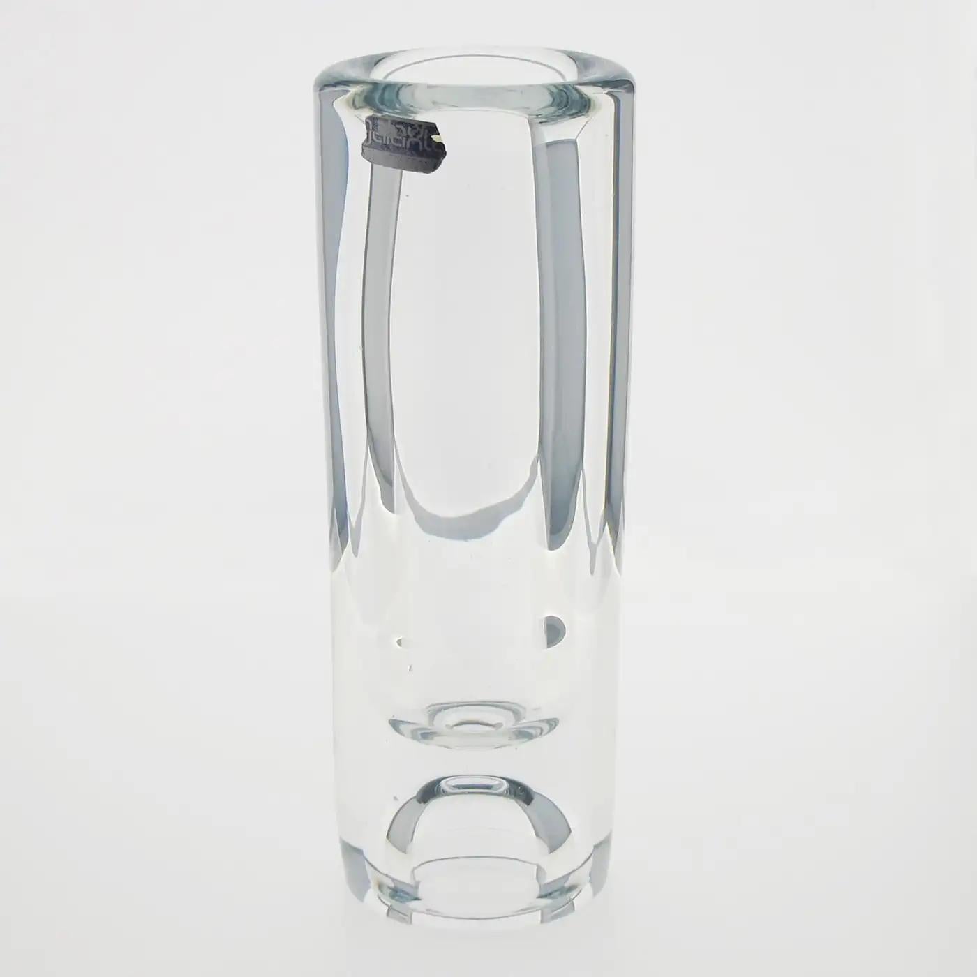 Compagnie Francaise du Cristal De Belroy for Daum produced this modernist crystal vase, circa 1970. The modern slim design has a thick base and tumbler shape. The vase still has its original sticker label on the side. This vase is part of the
